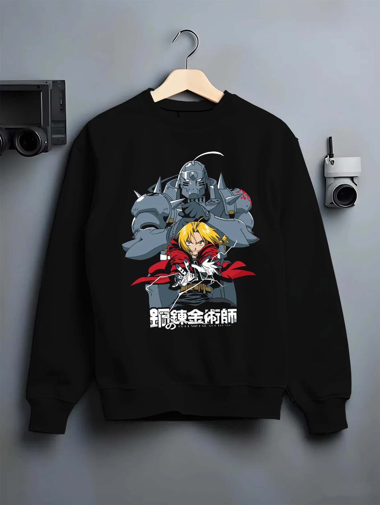 Black crewneck sweatshirt on hanger with Edward Elric Hoodie Fullmetal Alchemist Silver Armor graphic bold anime graphic.
