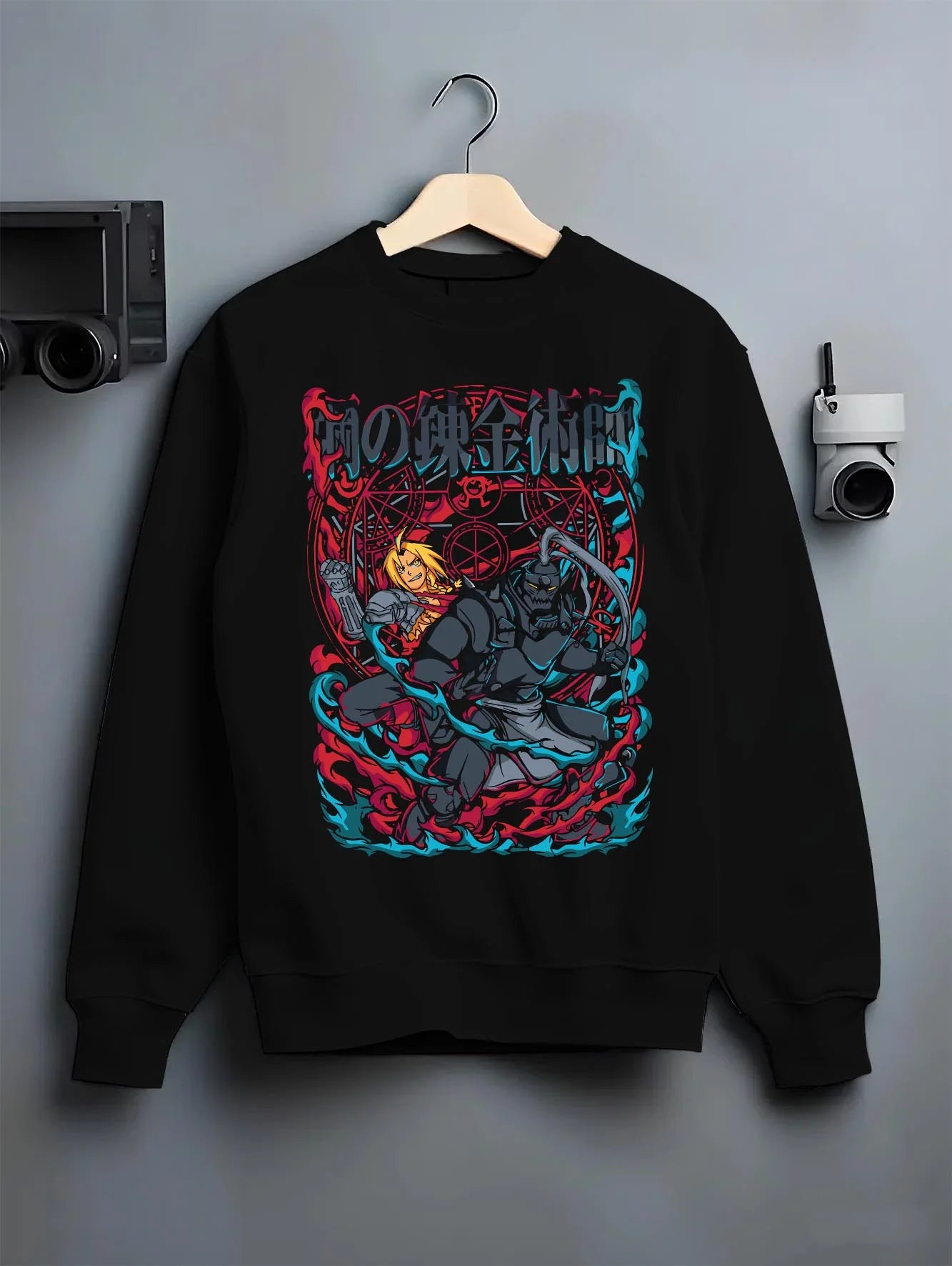 Black crewneck sweatshirt on hanger with Edward Elric Hoodie Fullmetal Alchemist Flame Scene graphic premium wear.