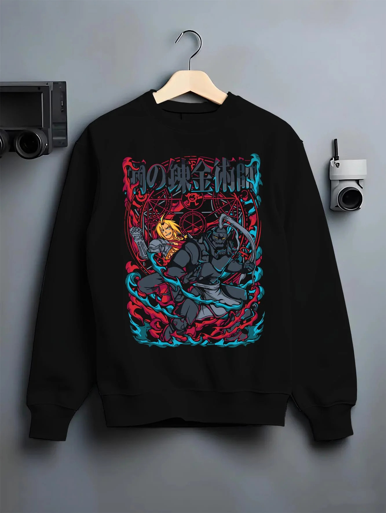 Black crewneck sweatshirt on hanger with Edward Elric Hoodie Fullmetal Alchemist Flame Scene graphic premium wear.