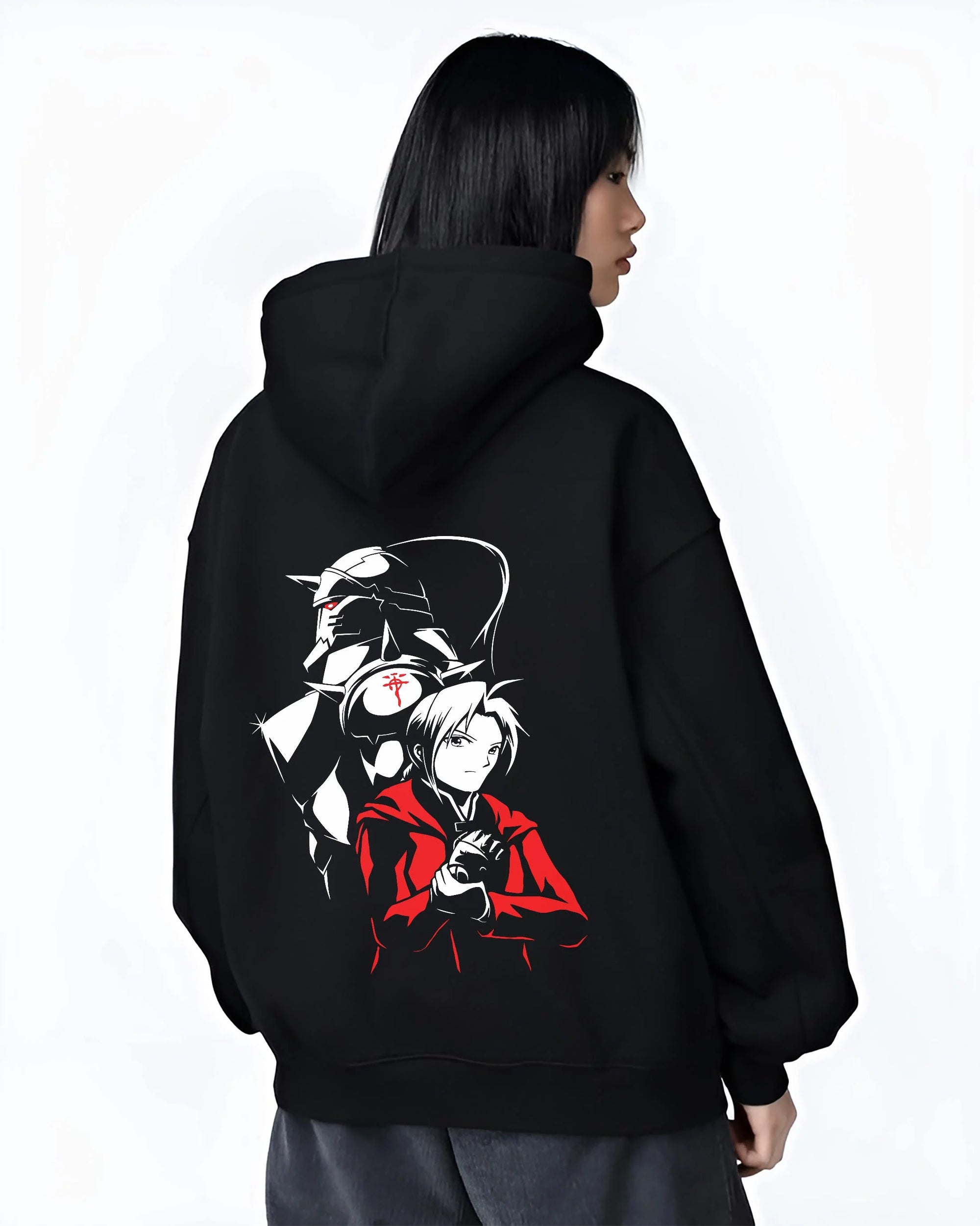 Black hoodie worn by female model, back view with Edward Elric Hoodie Fullmetal Alchemist Armor Duo graphic bold anime graphic.
