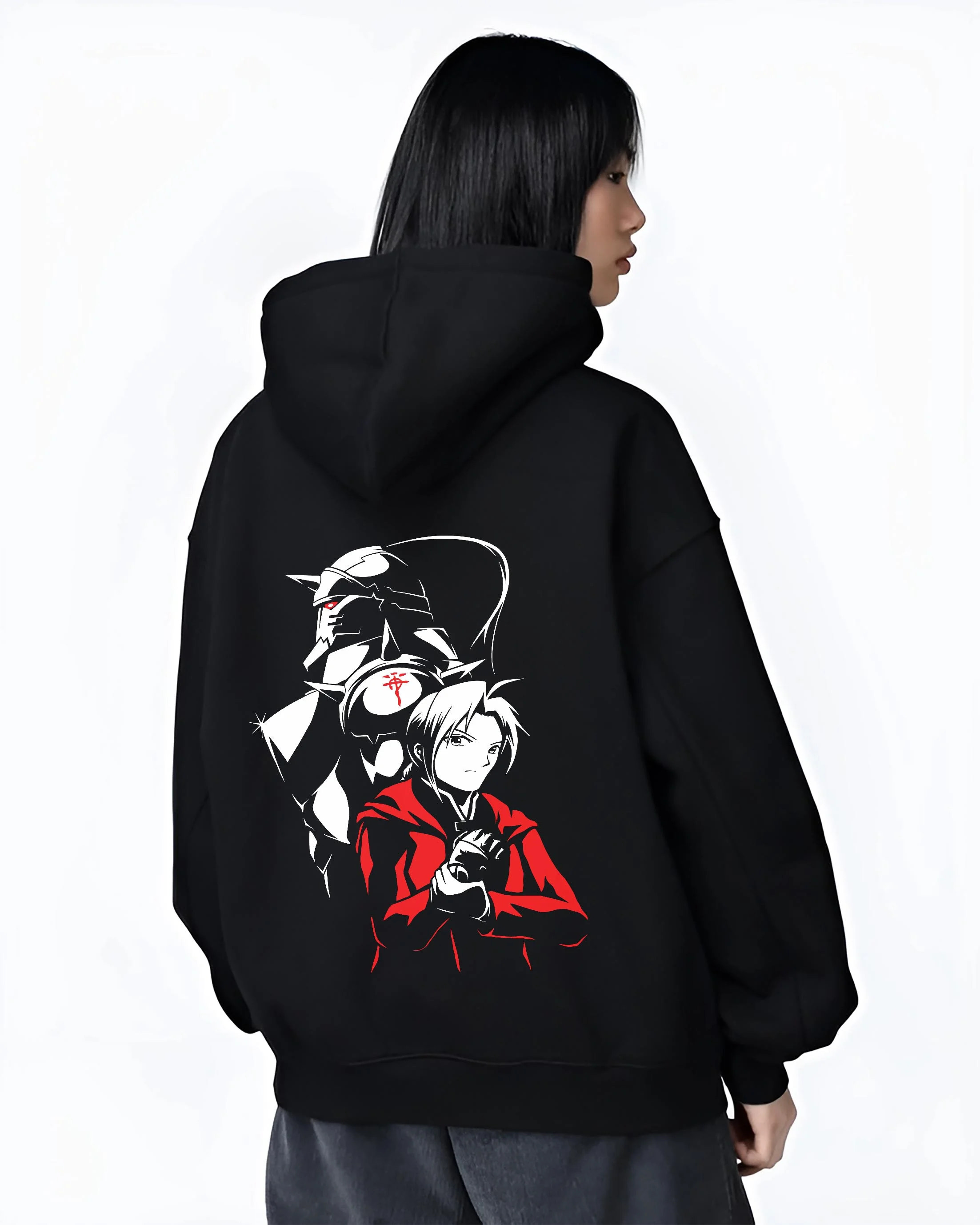Black hoodie worn by female model, back view with Edward Elric Hoodie Fullmetal Alchemist Armor Duo graphic bold anime graphic.