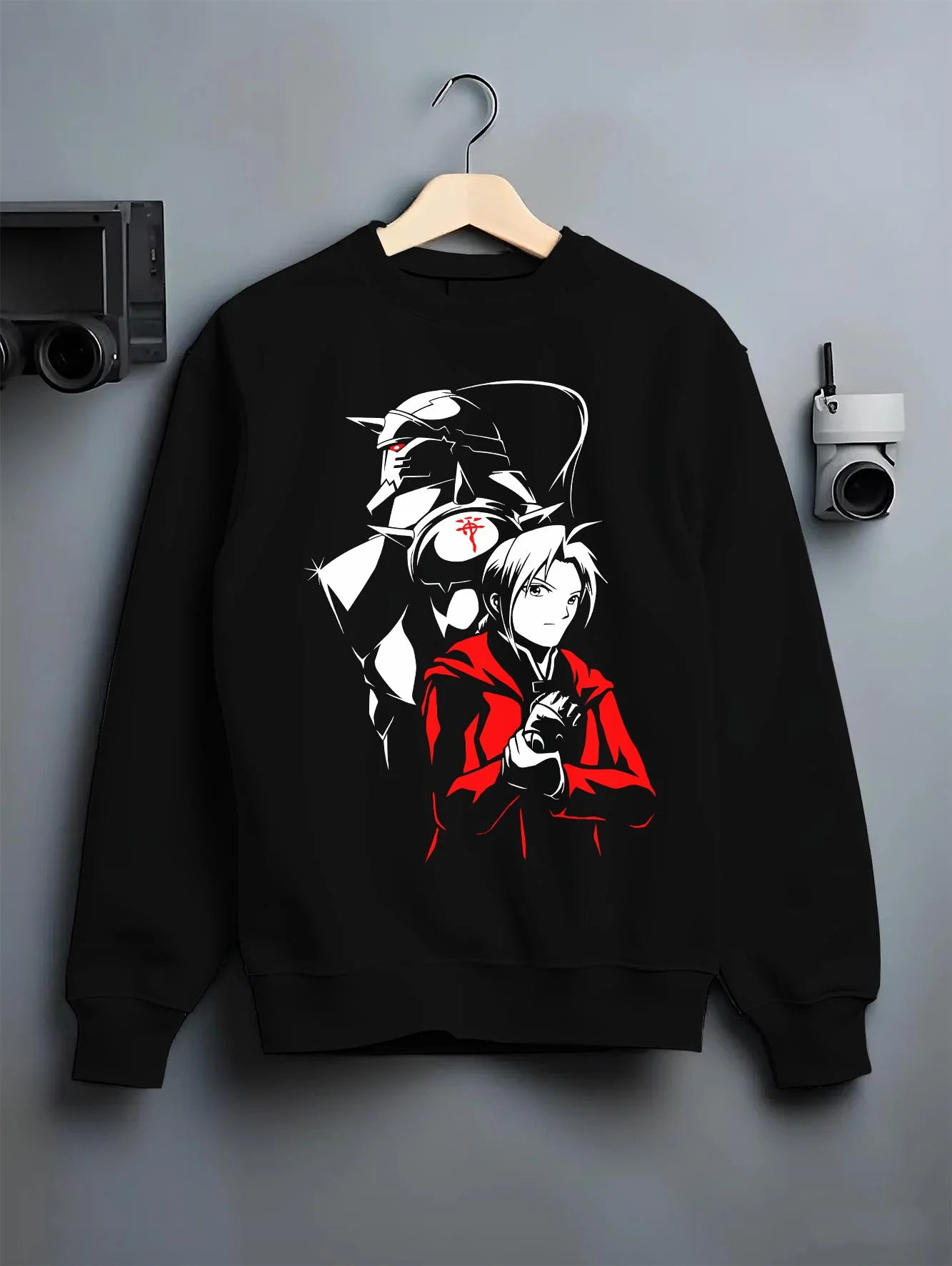 Black crewneck sweatshirt on hanger with Edward Elric Hoodie Fullmetal Alchemist Armor Duo graphic bold anime graphic.