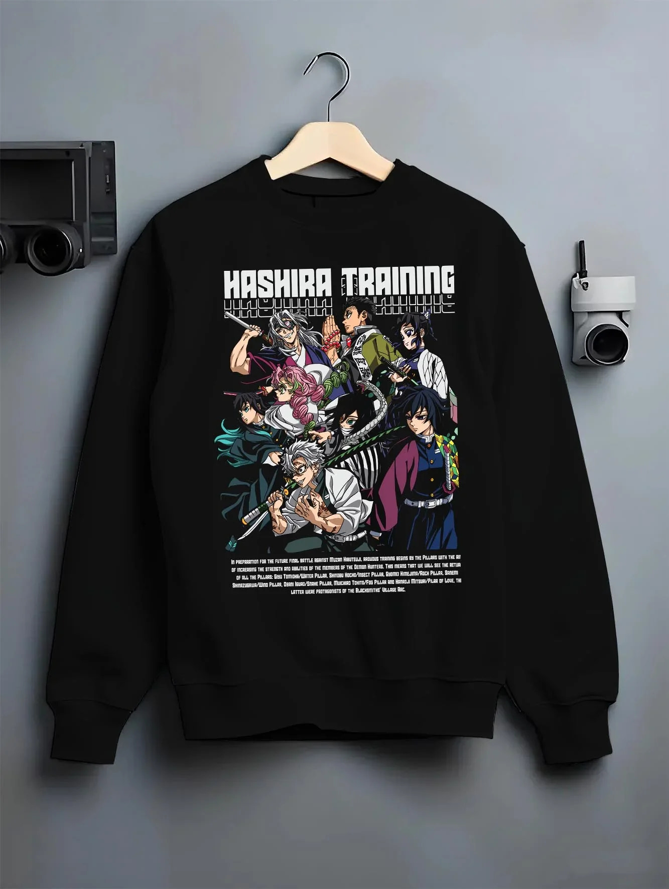 Black crewneck sweatshirt on hanger with Demon Slayer Hoodie Hashira Training Group Roster graphic bold anime graphic.