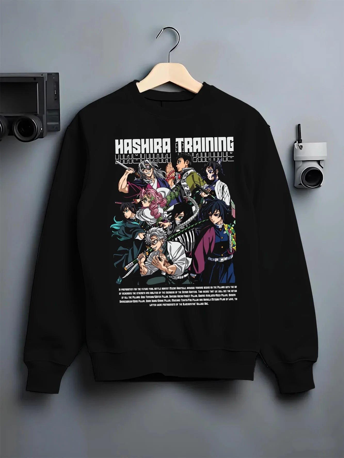 Black crewneck sweatshirt on hanger with Demon Slayer Hoodie Hashira Training Group Roster graphic bold anime graphic.