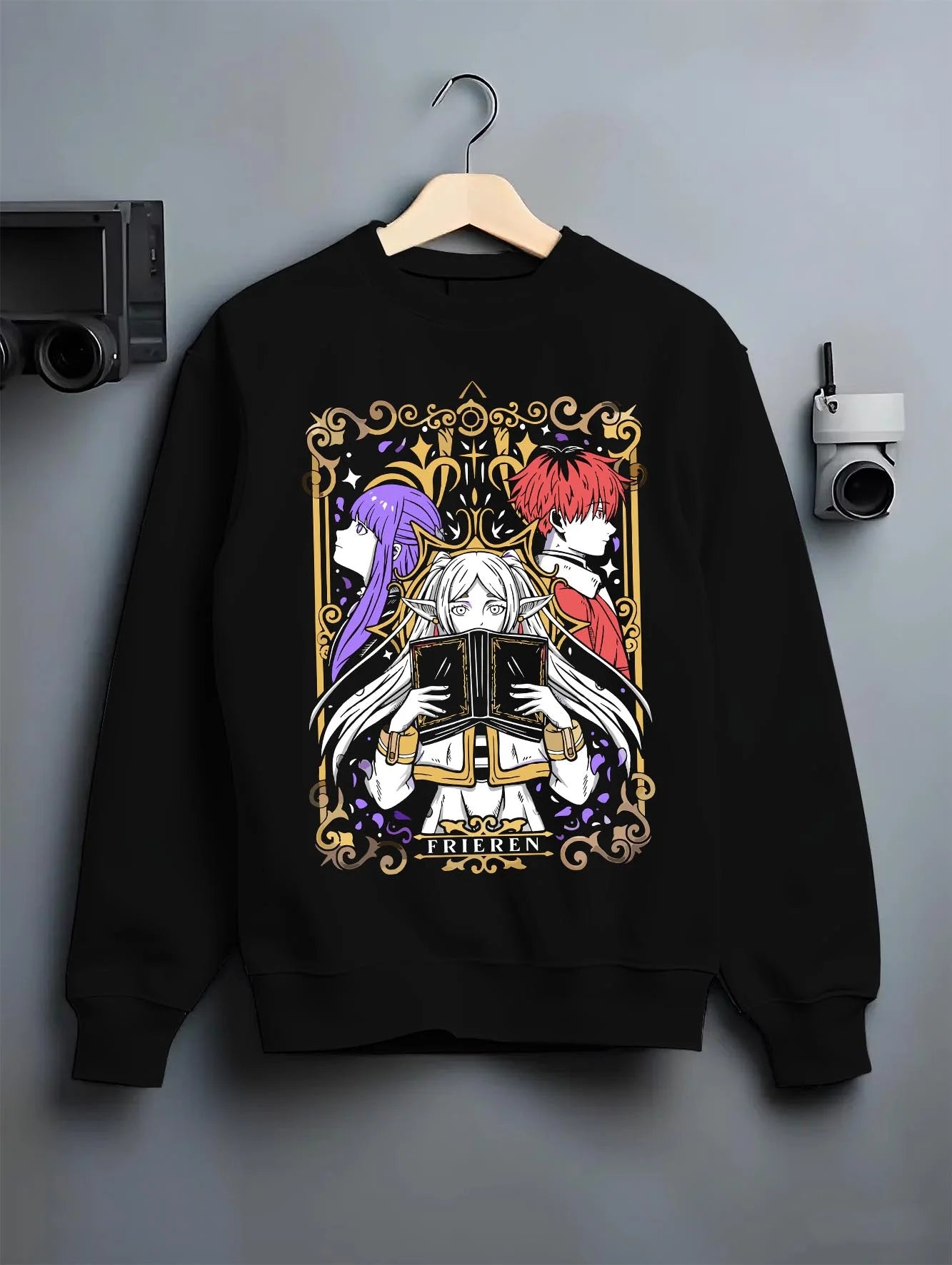 Black crewneck sweatshirt on hanger with Frieren Hoodie Beyond Journey’s End Magic Circle graphic streetwear graphic.