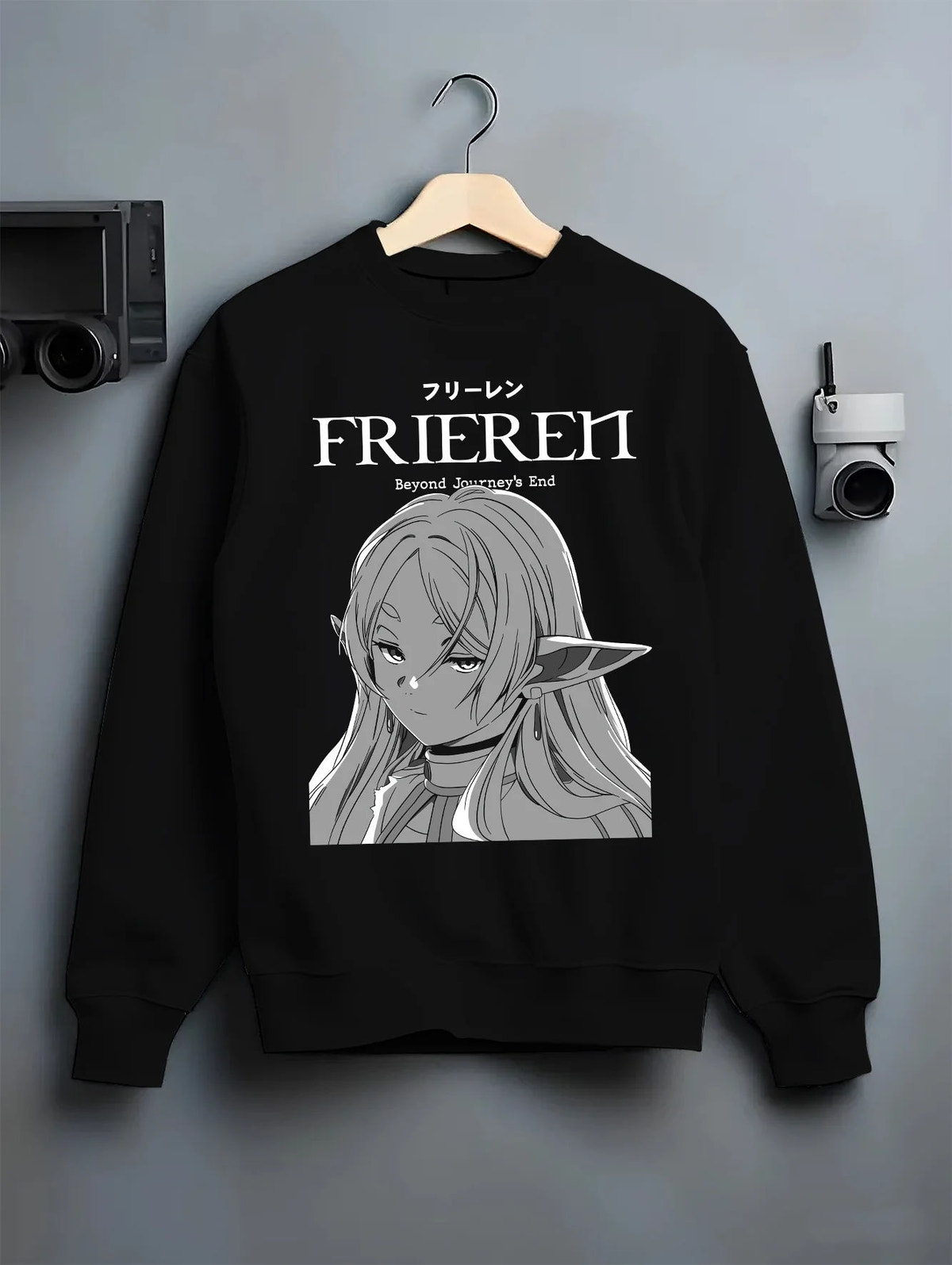 Black crewneck sweatshirt on hanger showing Frieren from Frieren: Beyond Journey's End: monochrome portrait