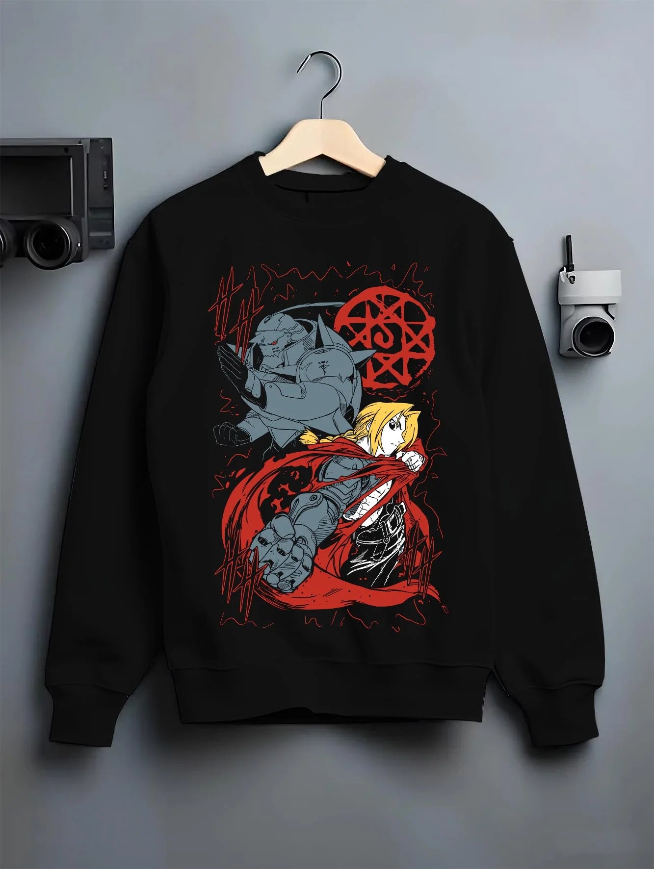 Black crewneck sweatshirt on hanger with Edward Elric Hoodie Fullmetal Alchemist Red Energy graphic bold anime graphic.