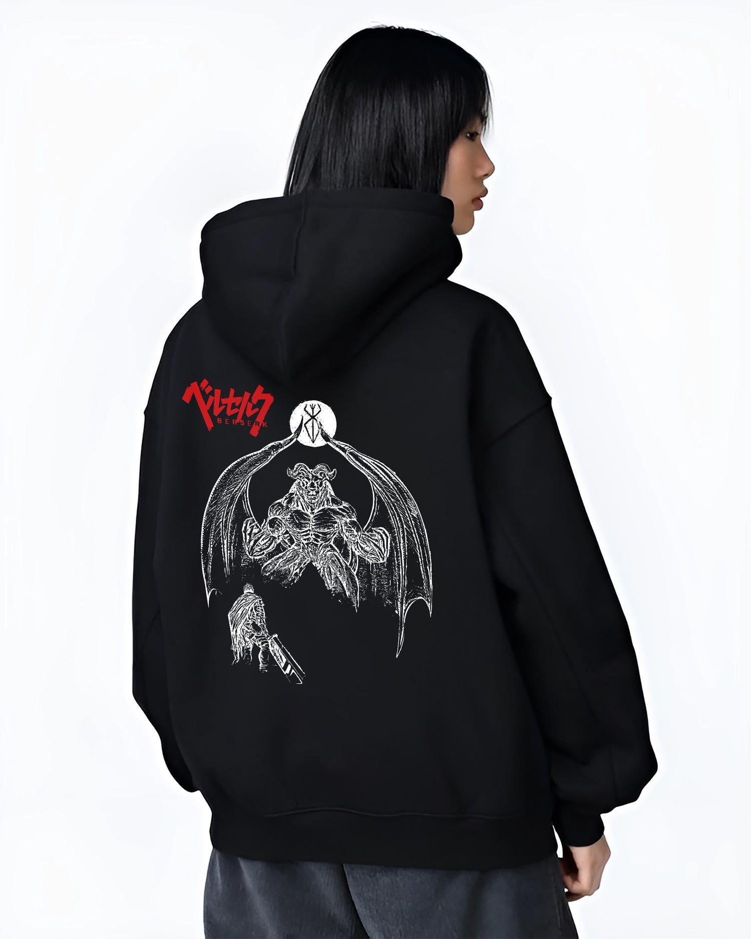 Black hoodie worn by a female model, back view, featuring Berserk Guts anime poster inspired artwork with demonic apostle under moon and gritty manga style.