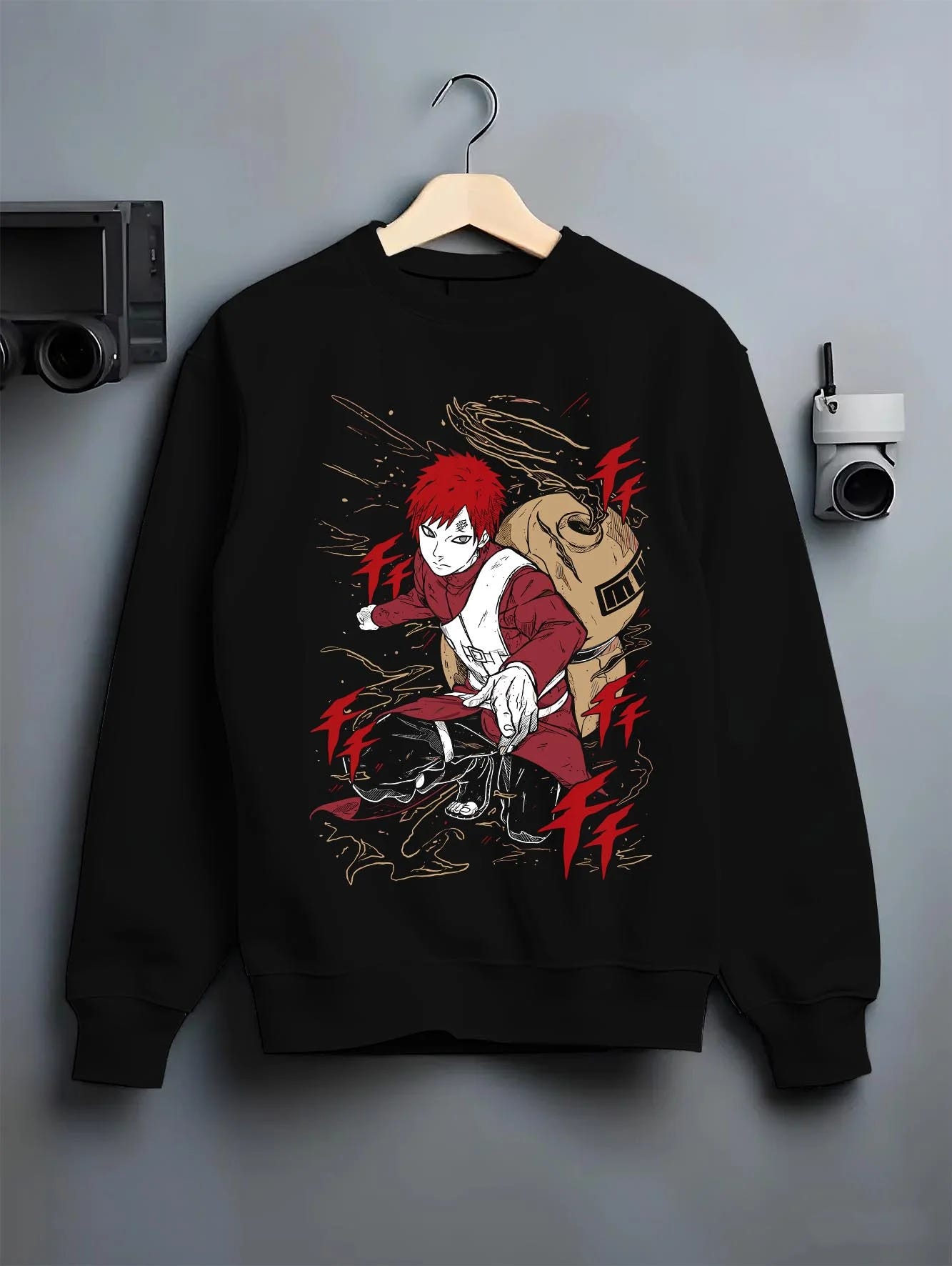 Black crewneck sweatshirt on hanger with Gaara Hoodie Naruto Red Sand Shinobi Desert Power graphic Gaara anime design.