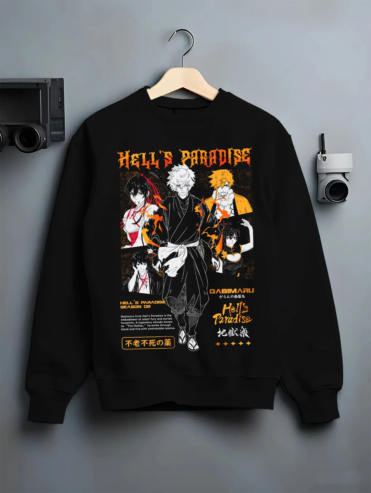 Black crewneck sweatshirt on hanger showing Hell's Paradise: Gabimaru and cast