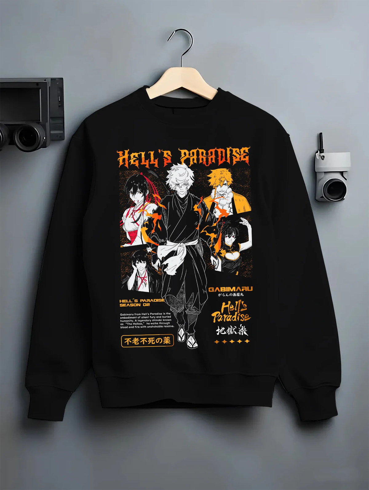 Black crewneck sweatshirt on hanger showing Hell's Paradise: Gabimaru and cast
