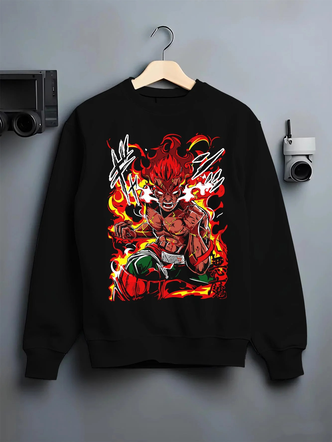Black crewneck sweatshirt on hanger, featuring shonen battle character Might Guy in fiery Eighth Gate pose with retro streetwear graphic.