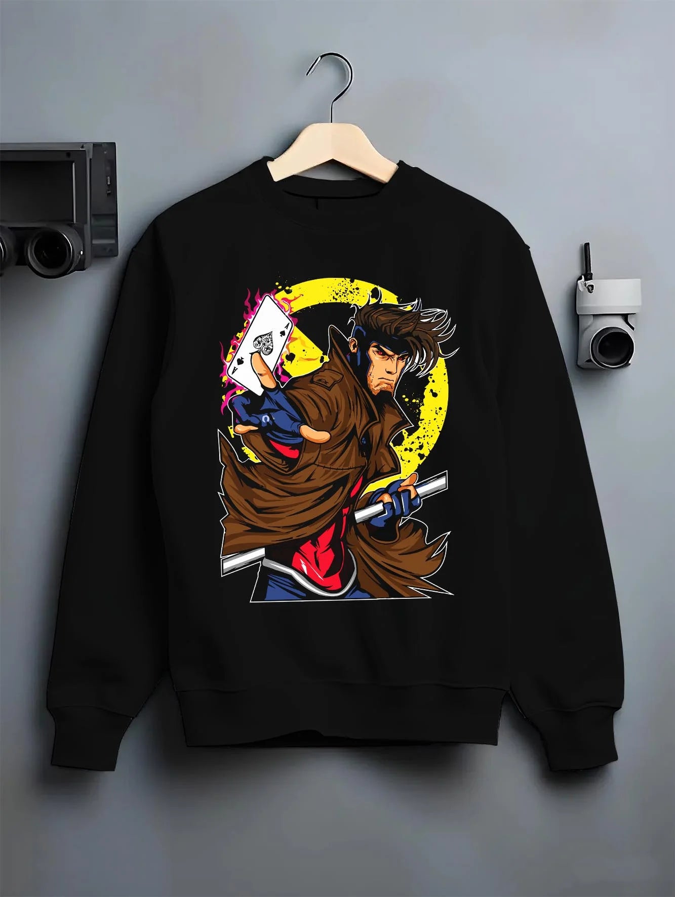 Black crewneck sweatshirt on hanger with Yu Gi Oh Hoodie Gambit Yami Yugi Duelist Jumper graphic bold anime graphic.