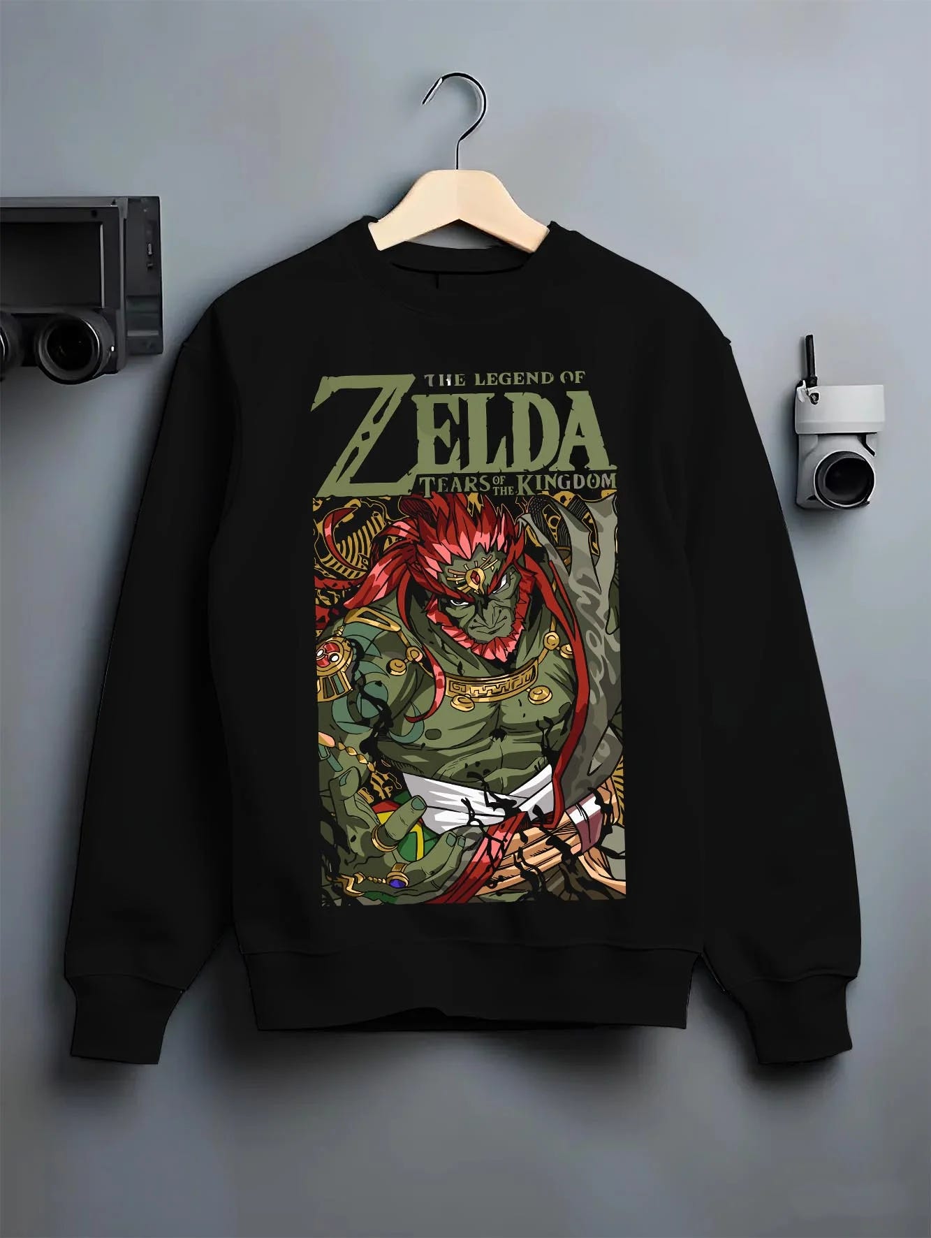 Black crewneck sweatshirt on hanger with Legend of Zelda Hoodie Ganondorf King Gerudo Jumper graphic bold anime graphic.