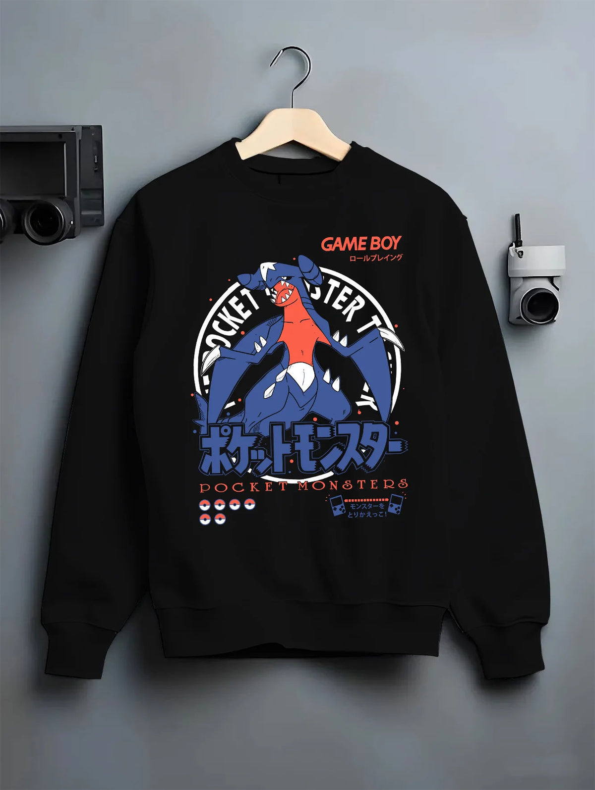Black crewneck sweatshirt on hanger showing Garchomp from Pokémon: blue dragon Pokémon