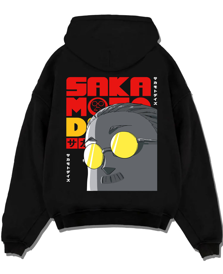 Black hoodie laid flat featuring Sakamoto Days gas mask assassin artwork.
