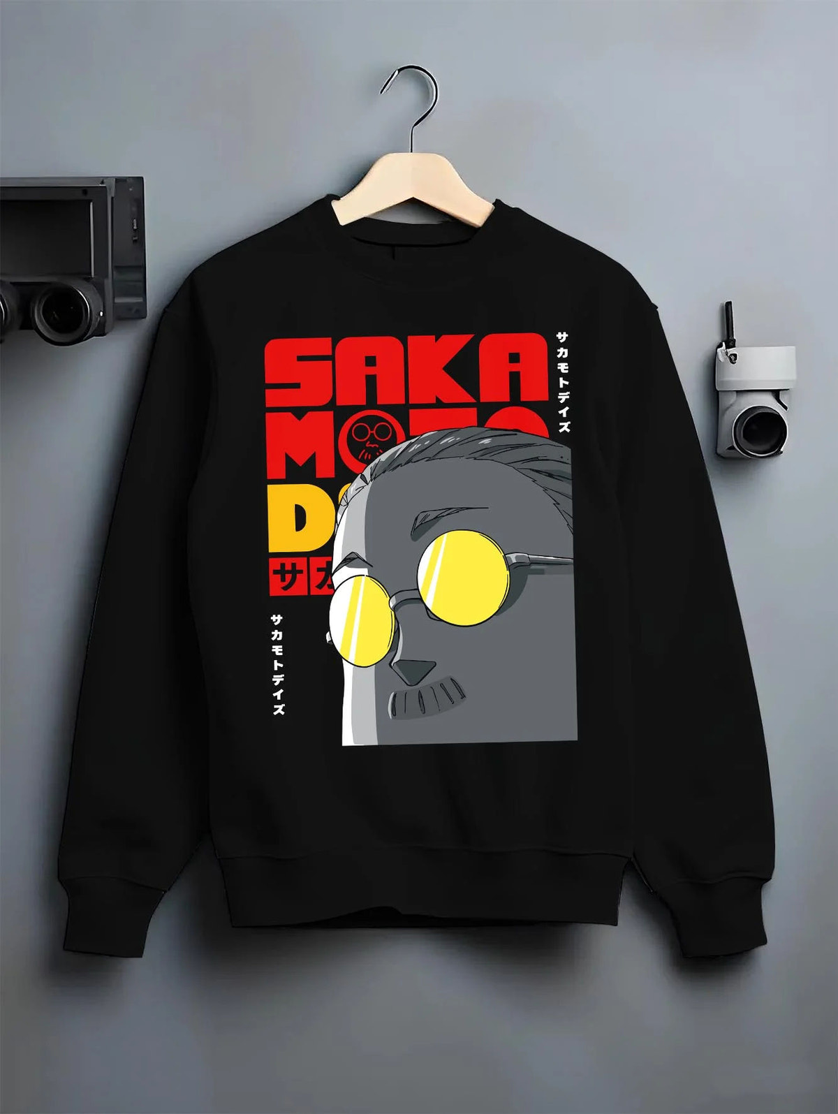 Black crewneck sweatshirt on hanger featuring Sakamoto Days gas mask assassin artwork.