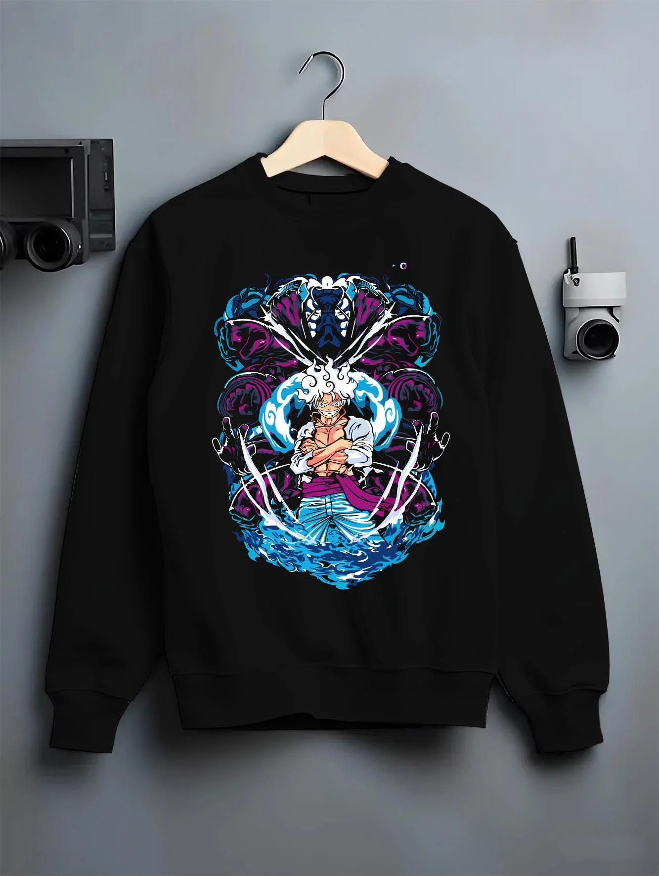 Black crewneck sweatshirt on hanger with One Piece Hoodie Luffy Gear Fifth Panel Jumper graphic bold anime graphic.
