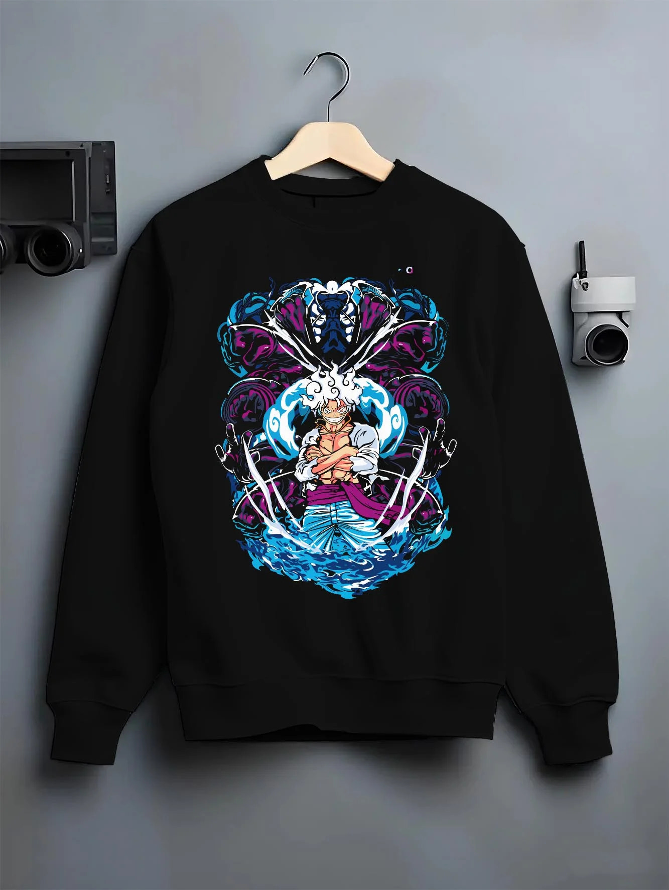 Black crewneck sweatshirt on hanger with One Piece Hoodie Luffy Gear Fifth Panel Jumper graphic bold anime graphic.