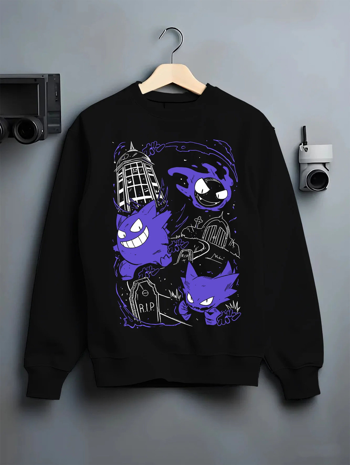Black crewneck sweatshirt on hanger with Gengar evolution line / retro Game Boy illustration from Pokémon illustrated back