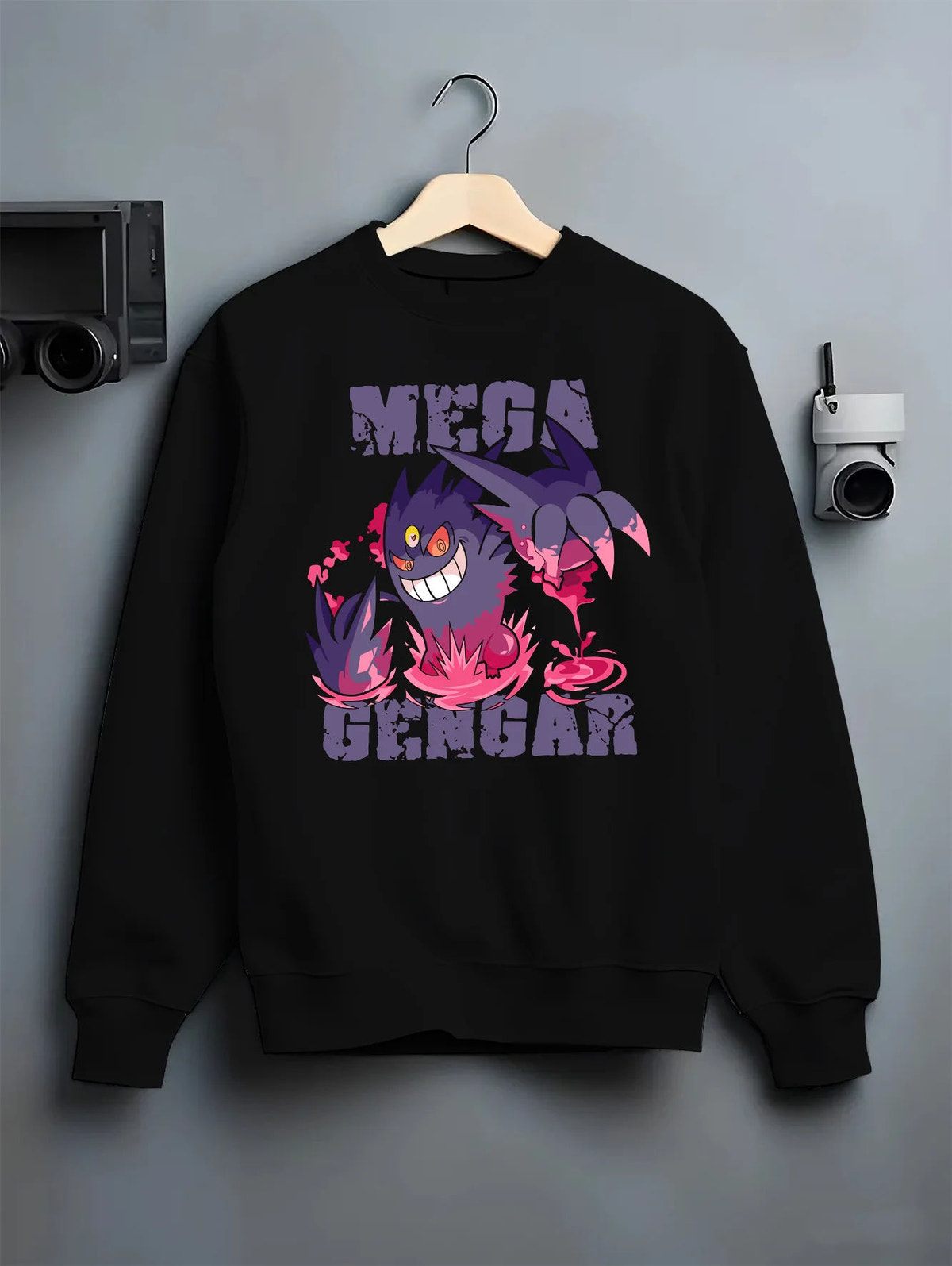 Black crewneck sweatshirt on hanger with Mega Gengar / pink flames from Pokémon illustrated back graphic