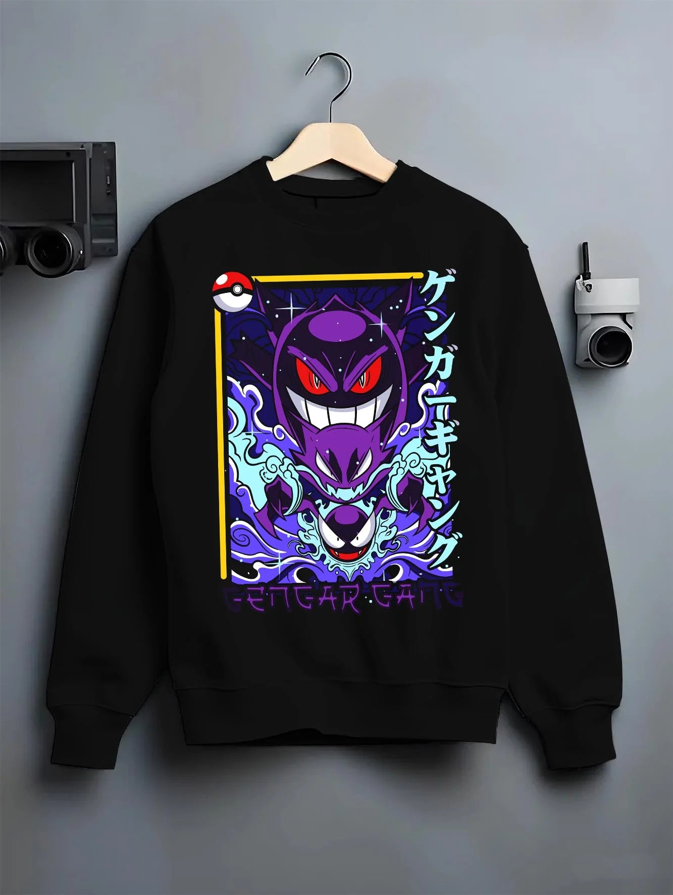 Black crewneck sweatshirt on hanger with Pokémon Hoodie Gengar Shadow Ball Jumper graphic Gengar anime design.