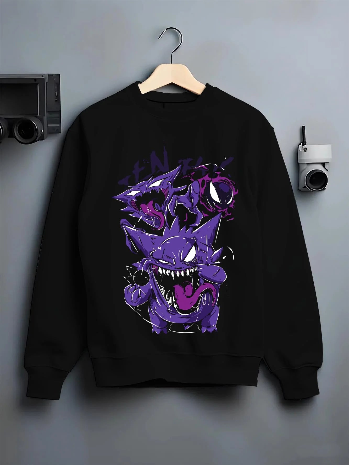 Black crewneck sweatshirt on hanger with Pokémon Hoodie Gengar Battle Ready Jumper graphic premium wear.