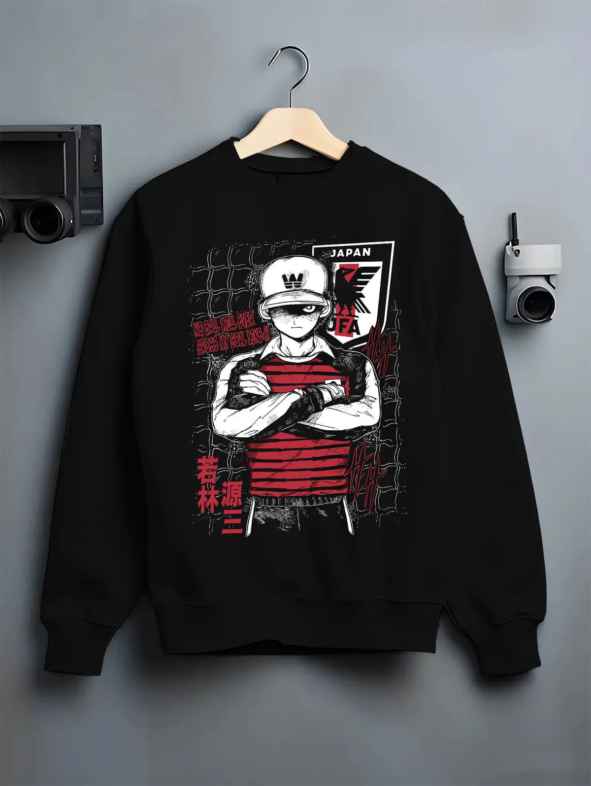 Black crewneck sweatshirt on hanger showing Genzo Wakabayashi from Captain Tsubasa: Japan national goalkeeper