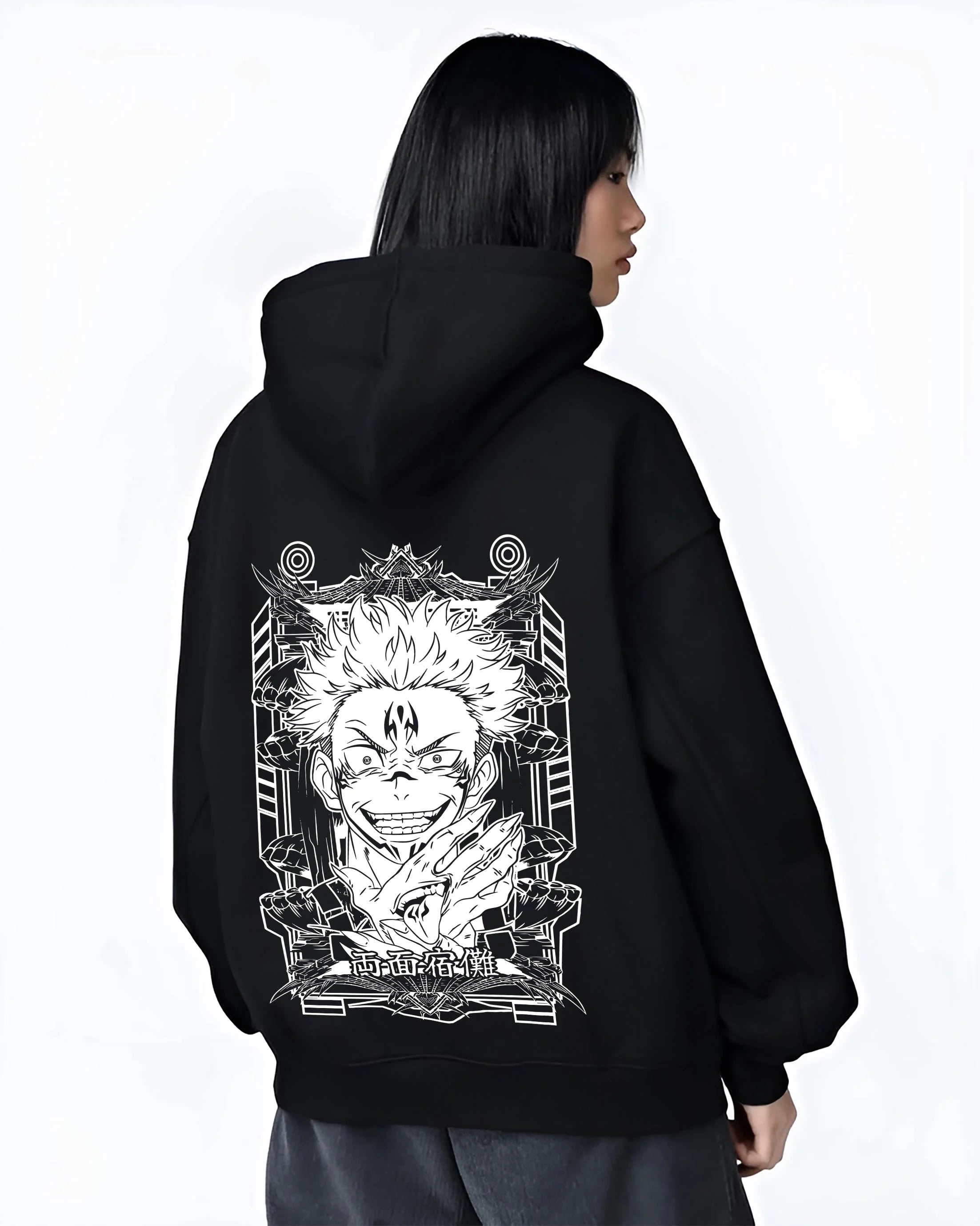 Black hoodie worn by female model, back view with Jujutsu Kaisen Hoodie Sukuna Grin Domain Jumper graphic bold anime graphic.