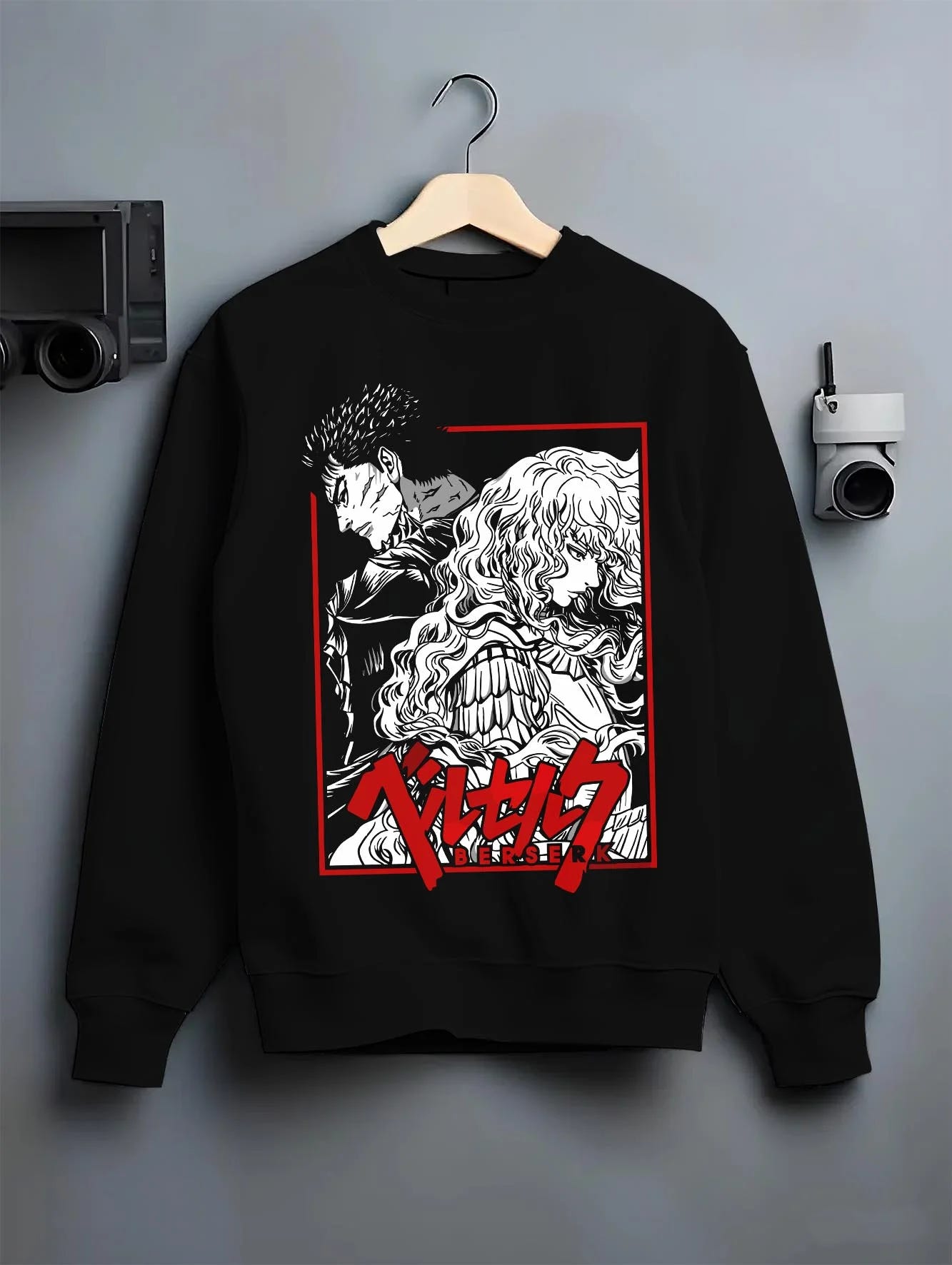 Black crewneck sweatshirt on hanger with Guts Hoodie Berserk Dragonslayer Sword Battle Rage graphic streetwear graphic.