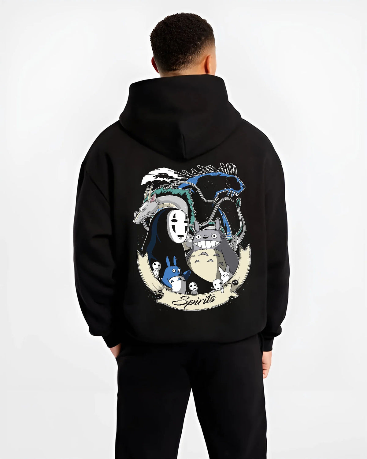 Black hoodie model back view showing Studio Ghibli: Totoro, No-Face and forest spirits