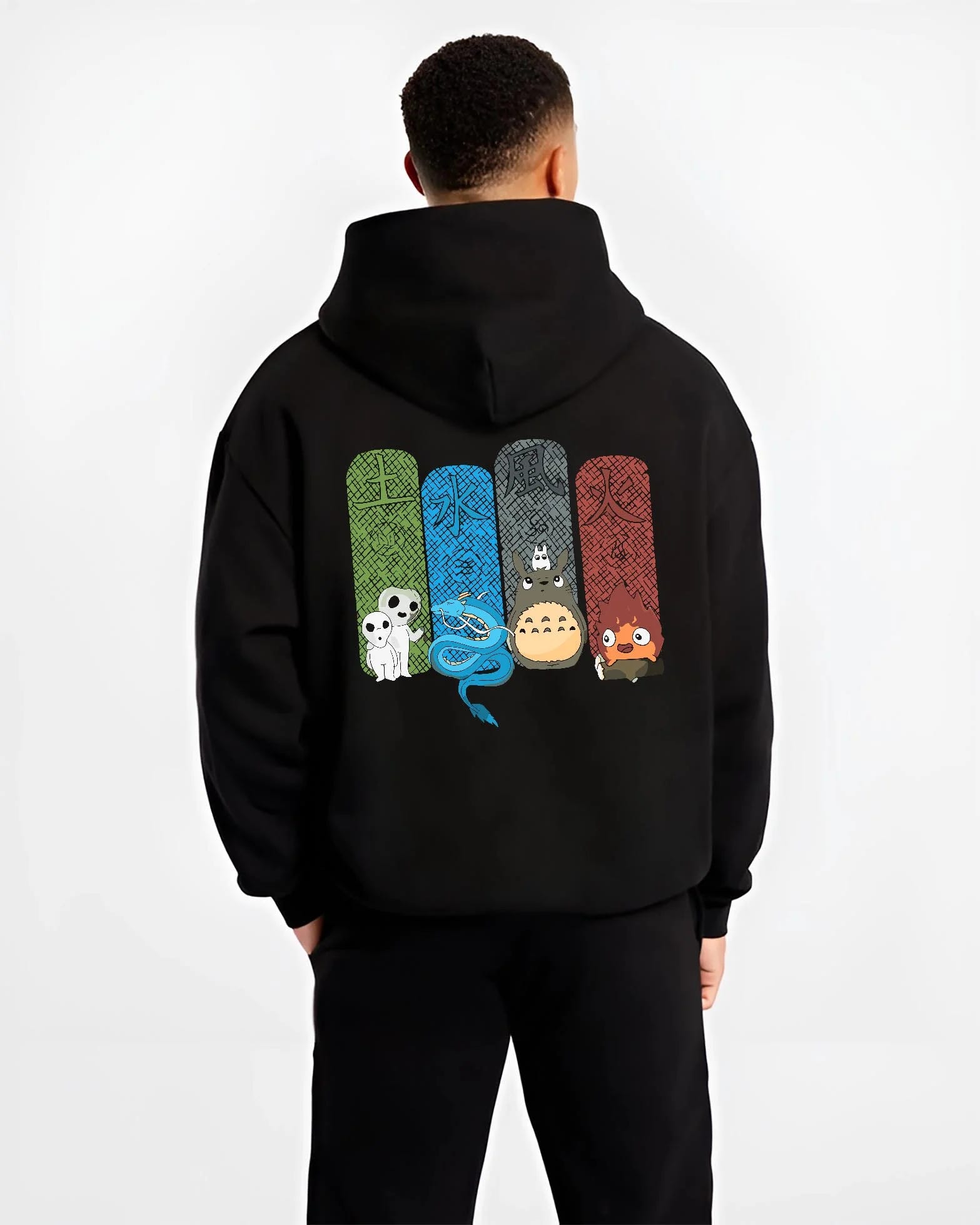 Black hoodie worn by male model, back view with Studio Ghibli Hoodie Totoro Spirited Forest Jumper graphic Totoro anime design.