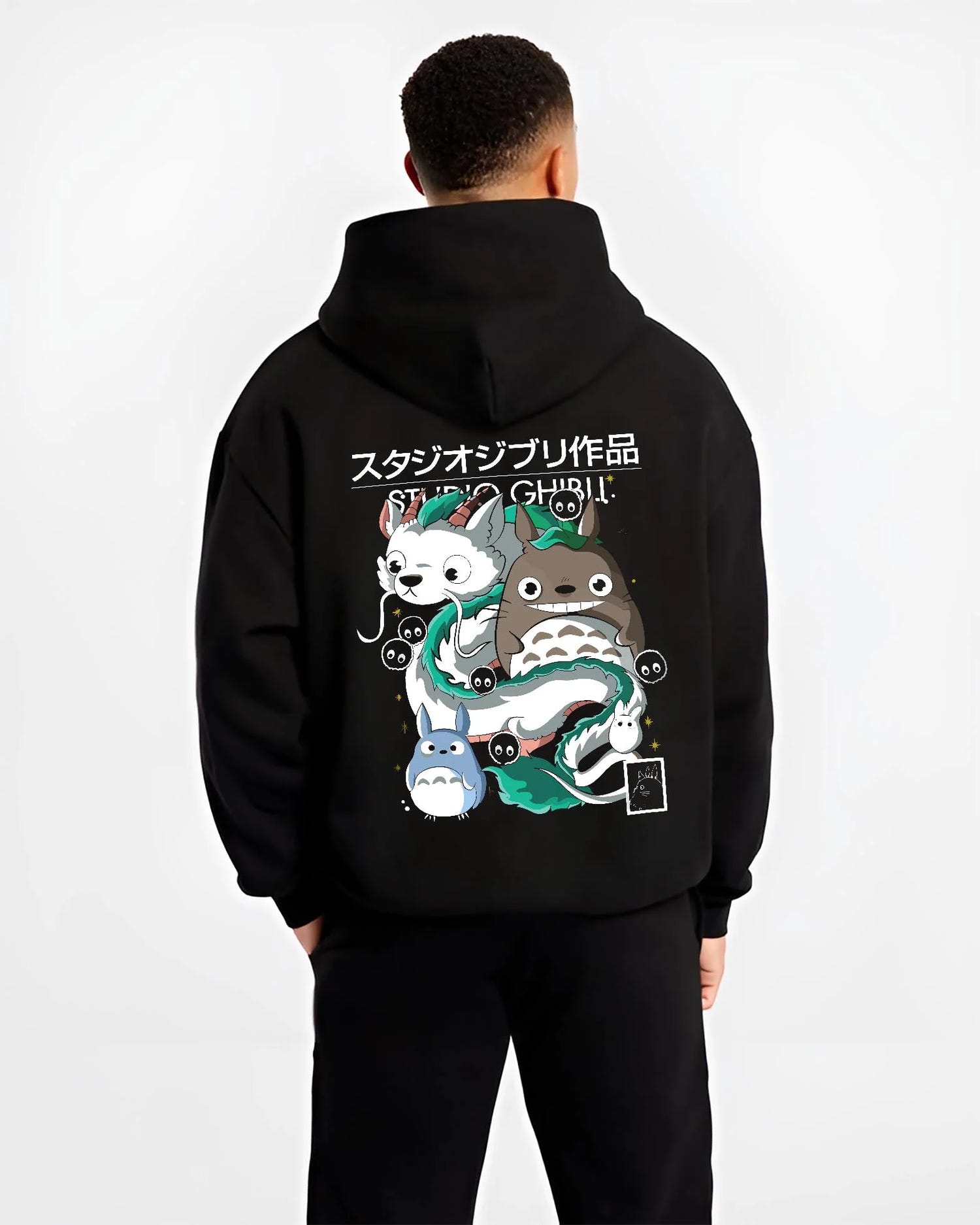 Black hoodie worn by male model, back view with Studio Ghibli Hoodie Totoro Blue White Jumper graphic Totoro anime design.