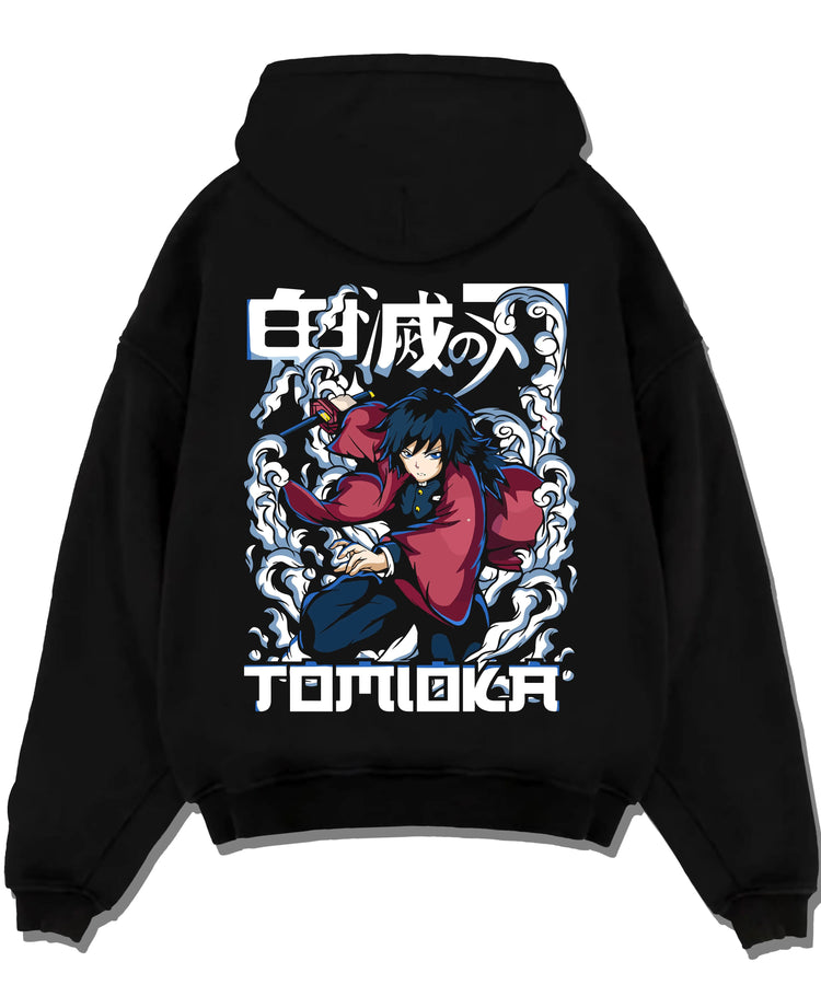 Black pullover hoodie laid flat with Demon Slayer Hoodie Giyu Tomioka Dynamic Pose Jumper graphic bold anime graphic.