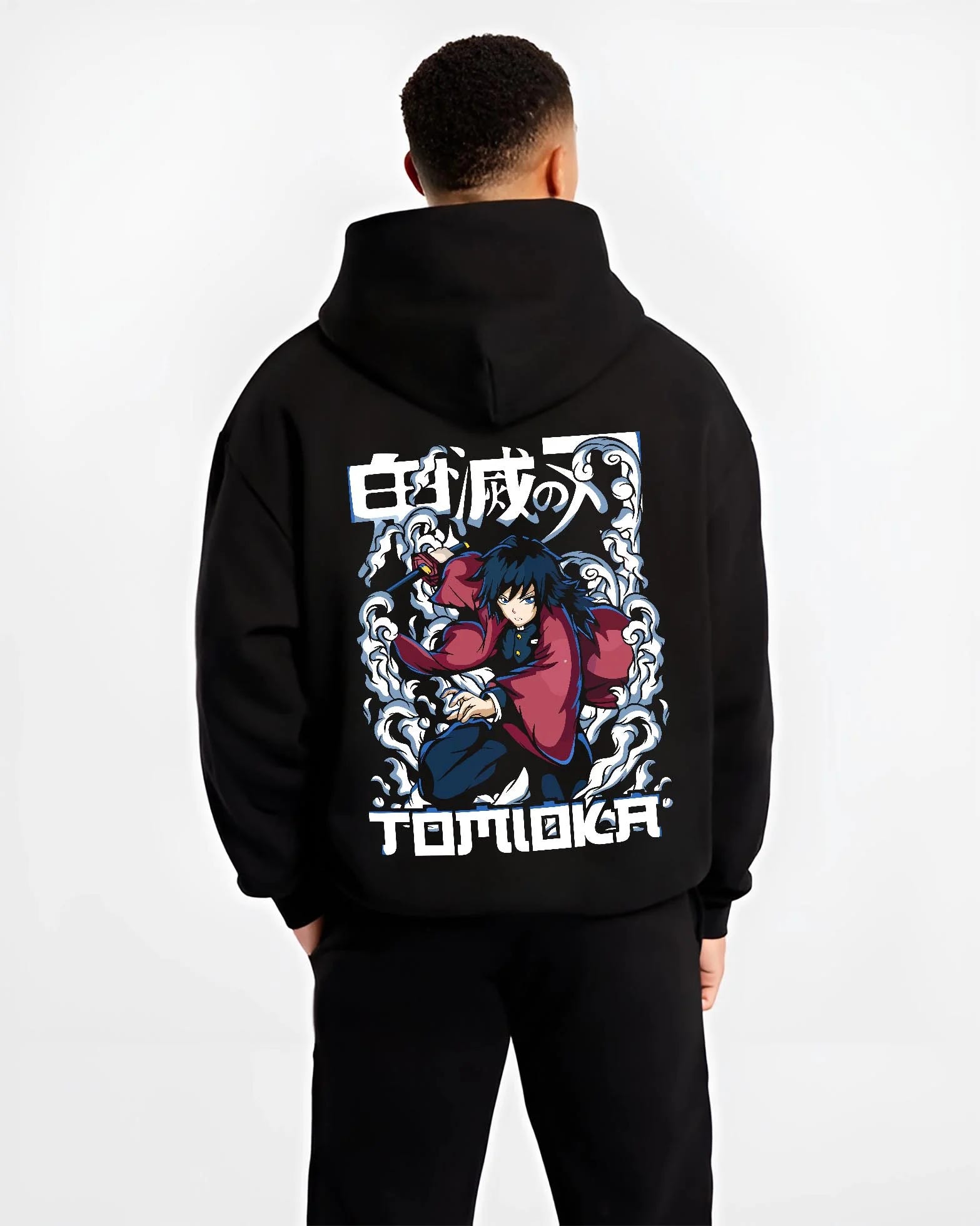 Black hoodie worn by male model, back view with Demon Slayer Hoodie Giyu Tomioka Dynamic Pose Jumper graphic streetwear graphic.