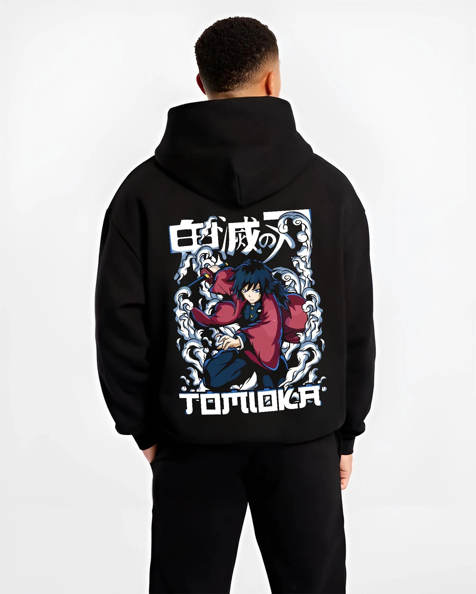 Black hoodie worn by male model, back view with Demon Slayer Hoodie Giyu Tomioka Dynamic Pose Jumper graphic streetwear graphic.