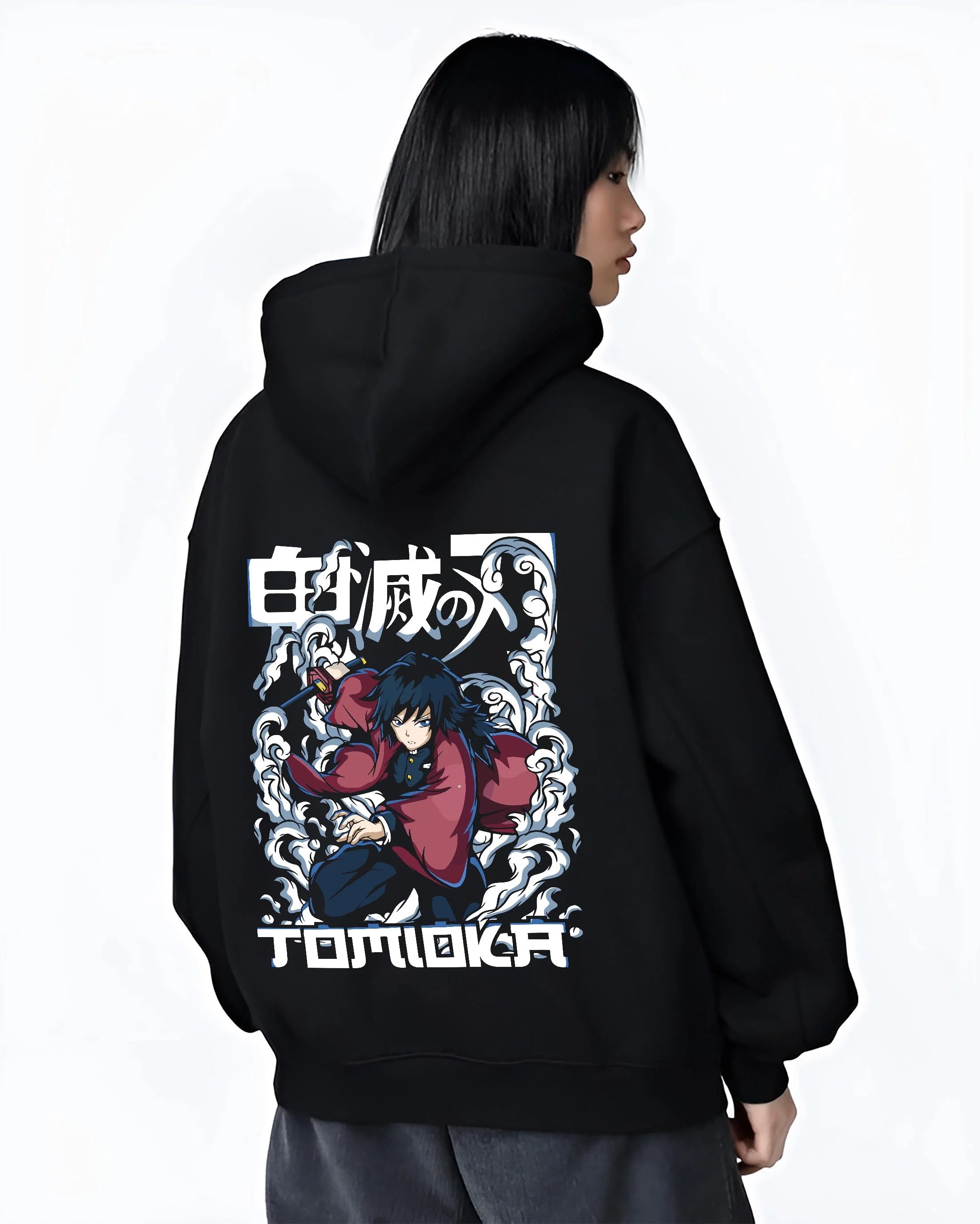 Black hoodie worn by female model, back view with Demon Slayer Hoodie Giyu Tomioka Dynamic Pose Jumper graphic streetwear graphic.