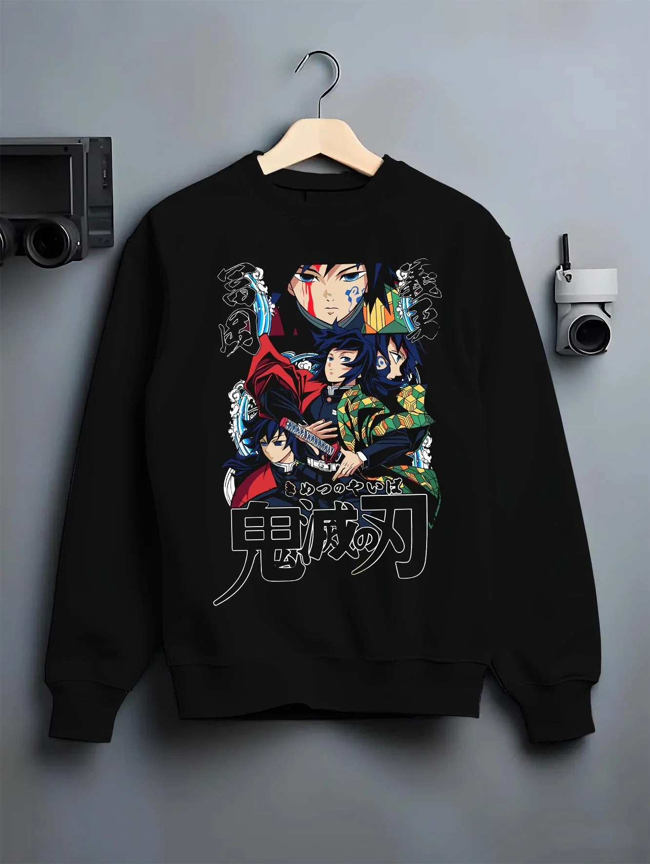 Black crewneck sweatshirt on hanger with Demon Slayer Hoodie Giyu Tomioka Water Pillar Jumper graphic bold anime graphic.