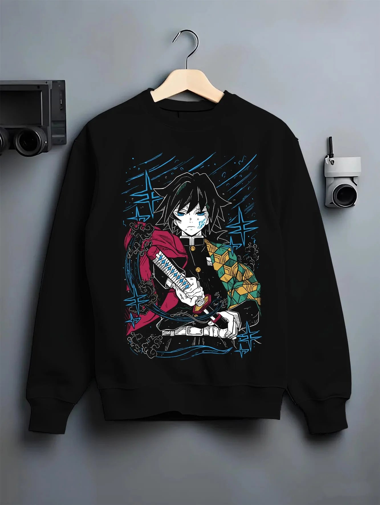 Black crewneck sweatshirt on hanger with Demon Slayer Hoodie Giyu Tomioka Upgraded Power Jumper graphic premium wear.
