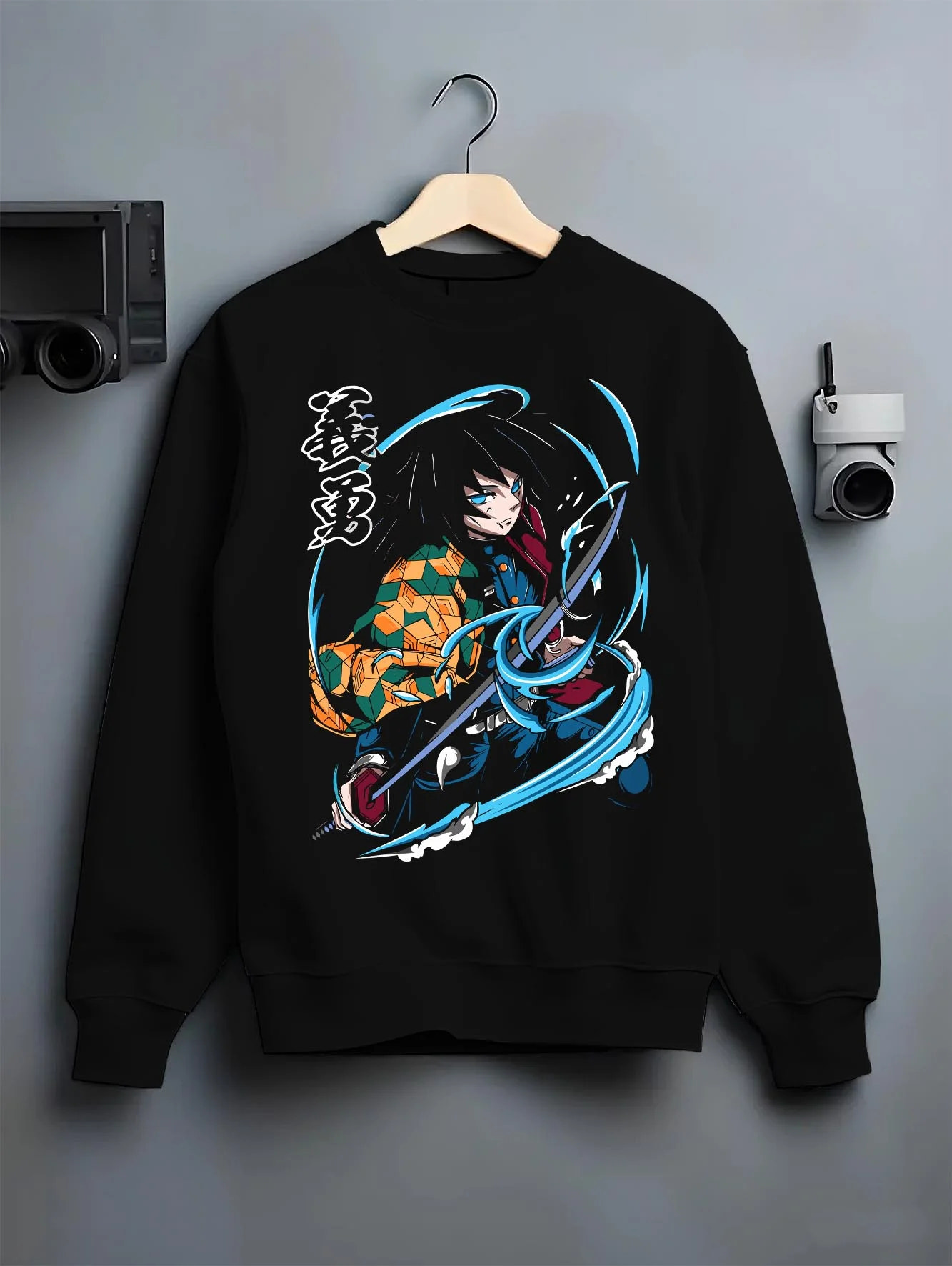 Black crewneck sweatshirt on hanger with Demon Slayer Hoodie Giyu Tomioka Sword Slash Jumper graphic bold anime graphic.