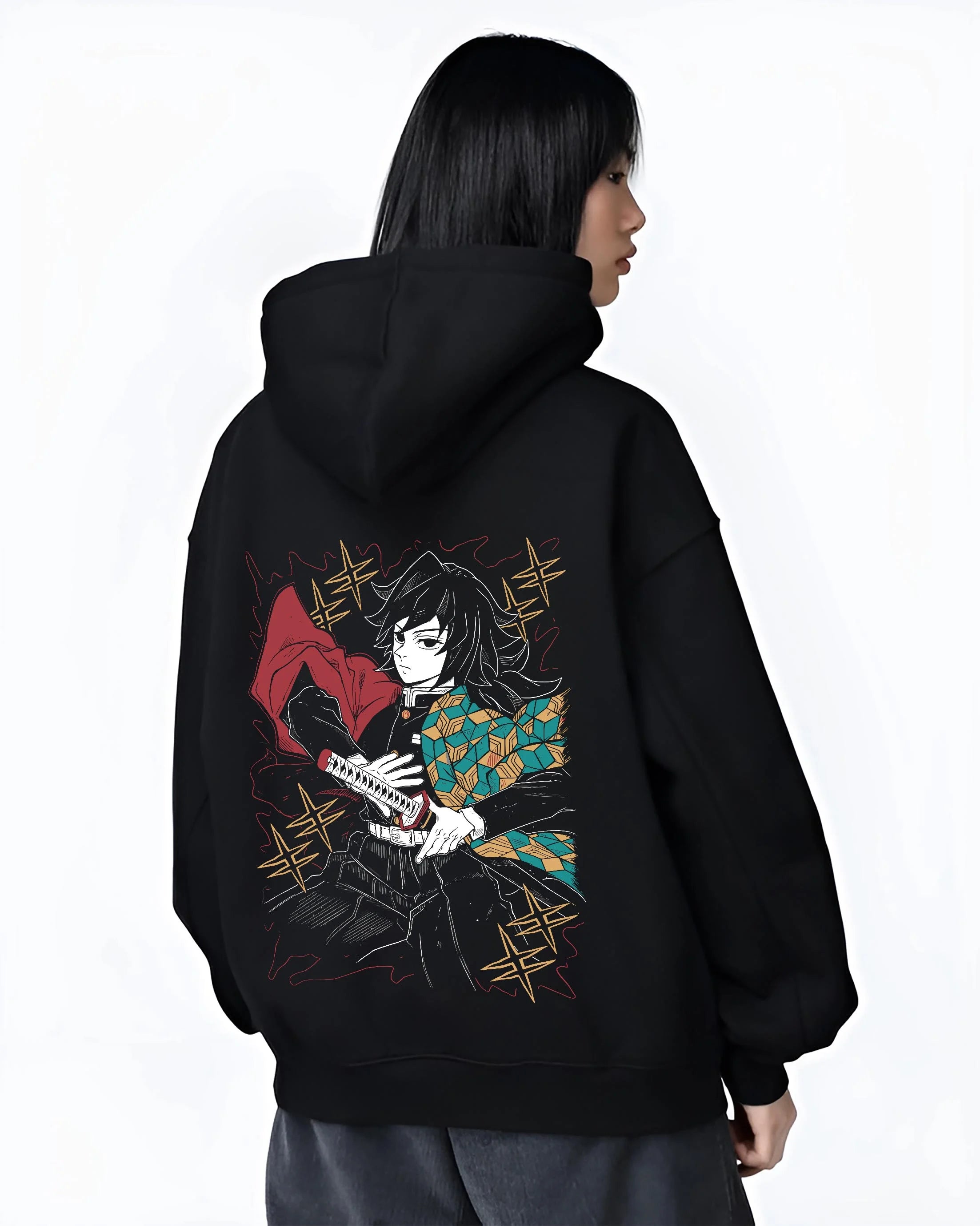 Black hoodie worn by female model, back view with Demon Slayer Hoodie Giyu Tomioka Swift Strike Jumper graphic bold anime graphic.