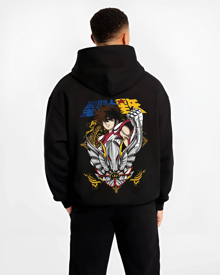 Black hoodie worn by male model from the back featuring Pegasus Seiya Saint Seiya gold wings artwork.