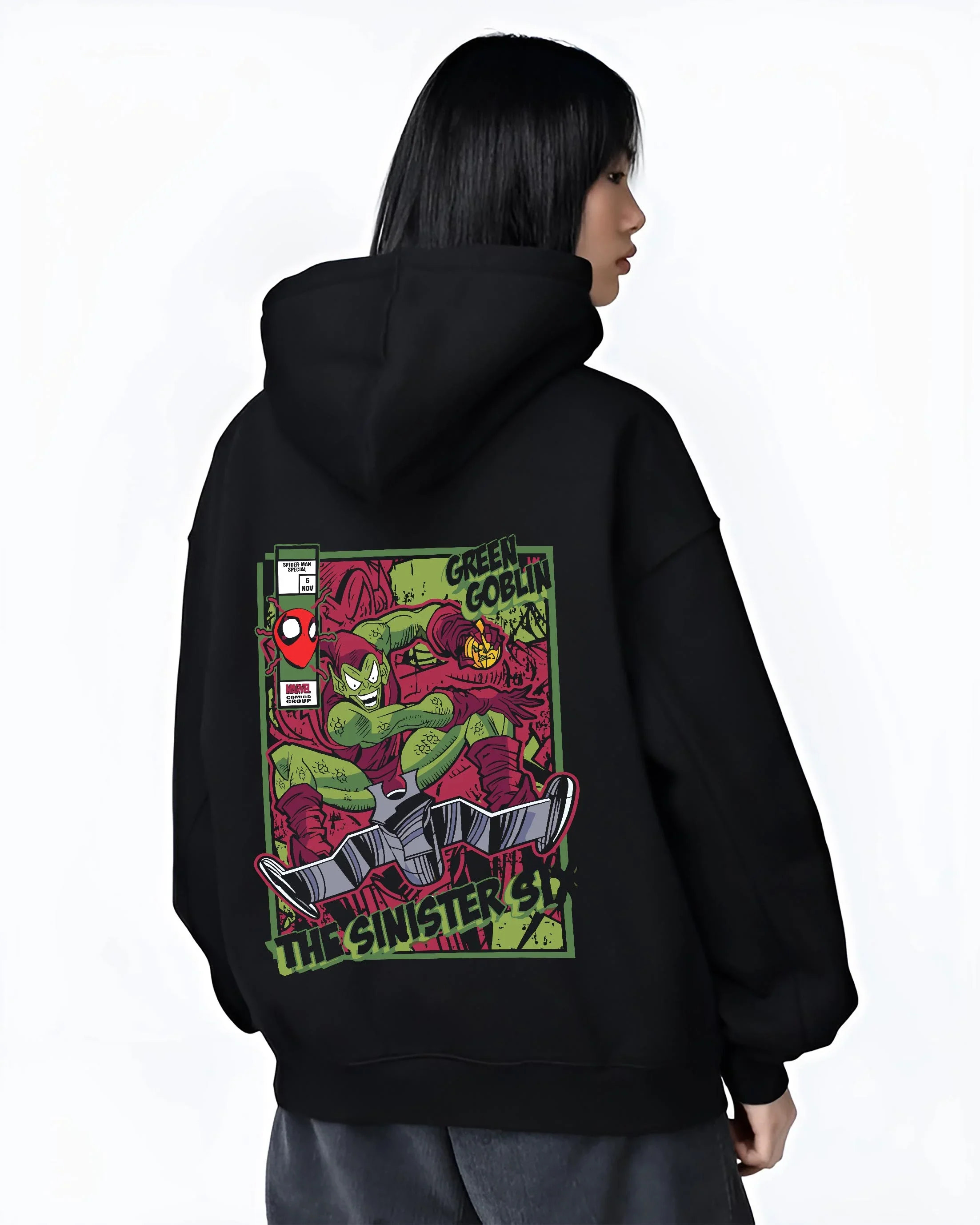 Black hoodie worn by female model, back view with Green Goblin Hoodie Marvel Sinister Spider Villain graphic premium wear.
