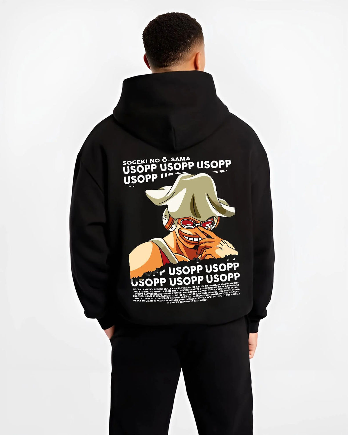 Black hoodie worn by male model from the back featuring God Usopp One Piece meme sniper artwork.