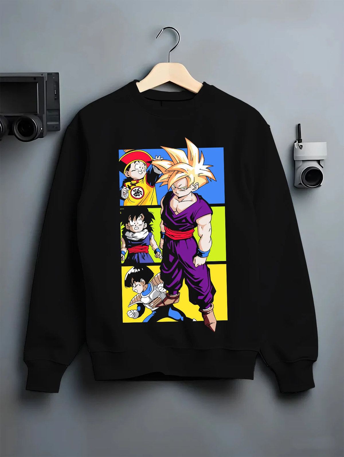Black crewneck sweatshirt on hanger with Son Gohan Super Saiyan manga collage from Dragon Ball illustrated back graphic