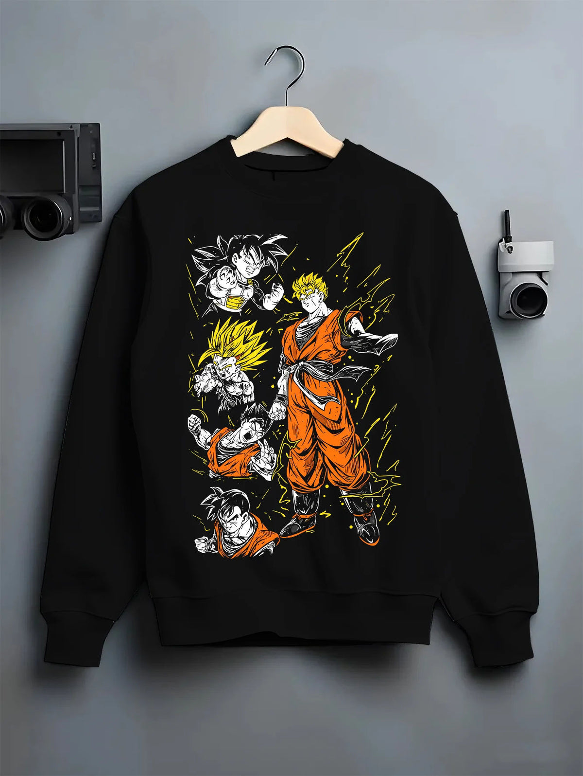 Black crewneck sweatshirt on hanger showing Gohan and Goku from Dragon Ball: Saiyan transformations