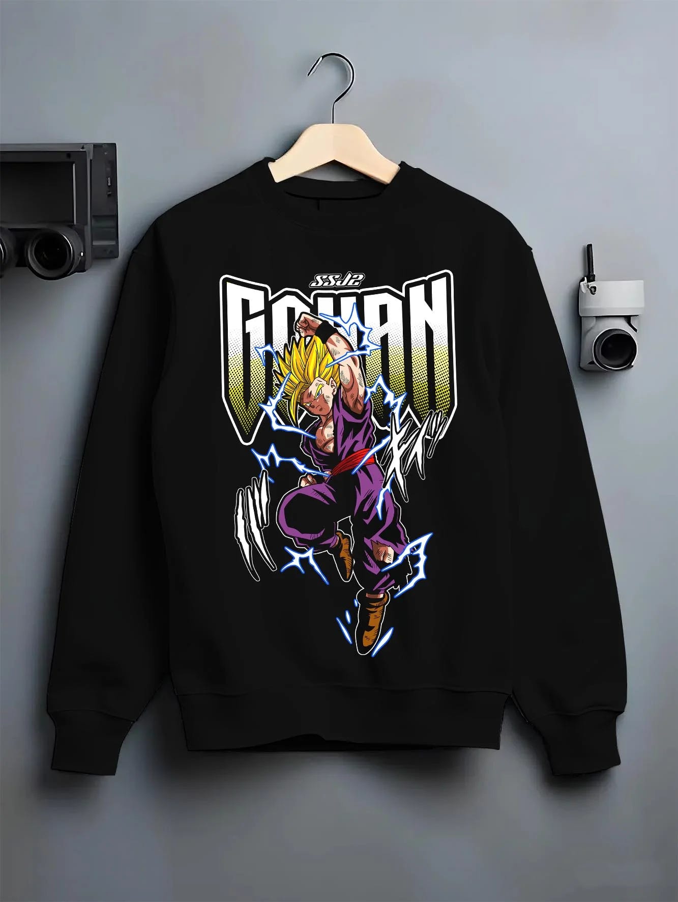 Black crewneck sweatshirt on hanger with Dragon Ball Z Hoodie Gohan Super Saiyan Power Jumper graphic Gohan anime design.