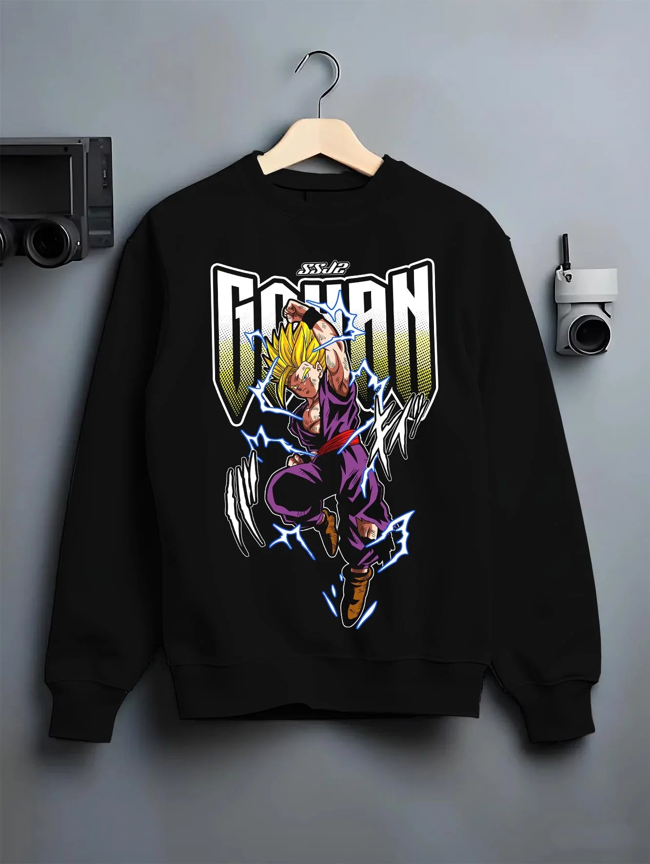 Black crewneck sweatshirt on hanger with Dragon Ball Z Hoodie Gohan Super Saiyan Power Jumper graphic Gohan anime design.