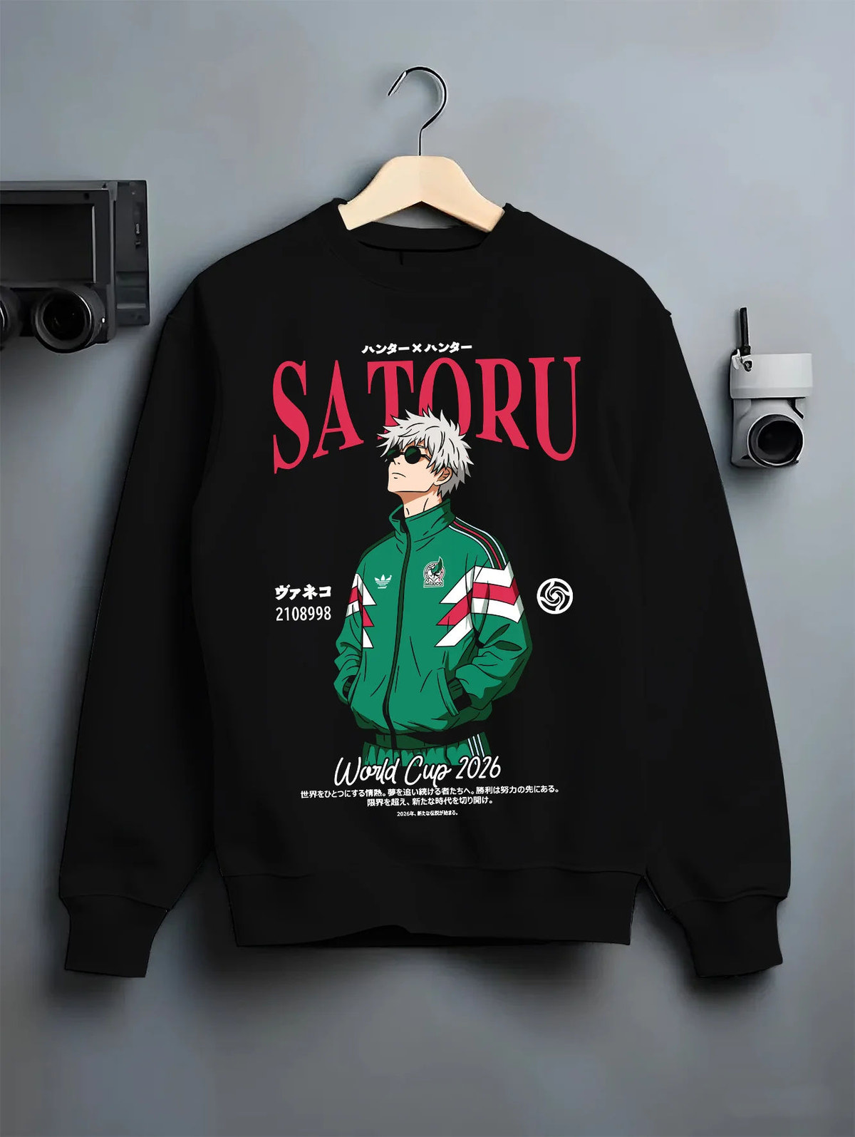 Black crewneck sweatshirt on hanger showing Satoru Gojo from Jujutsu Kaisen: green football track jacket