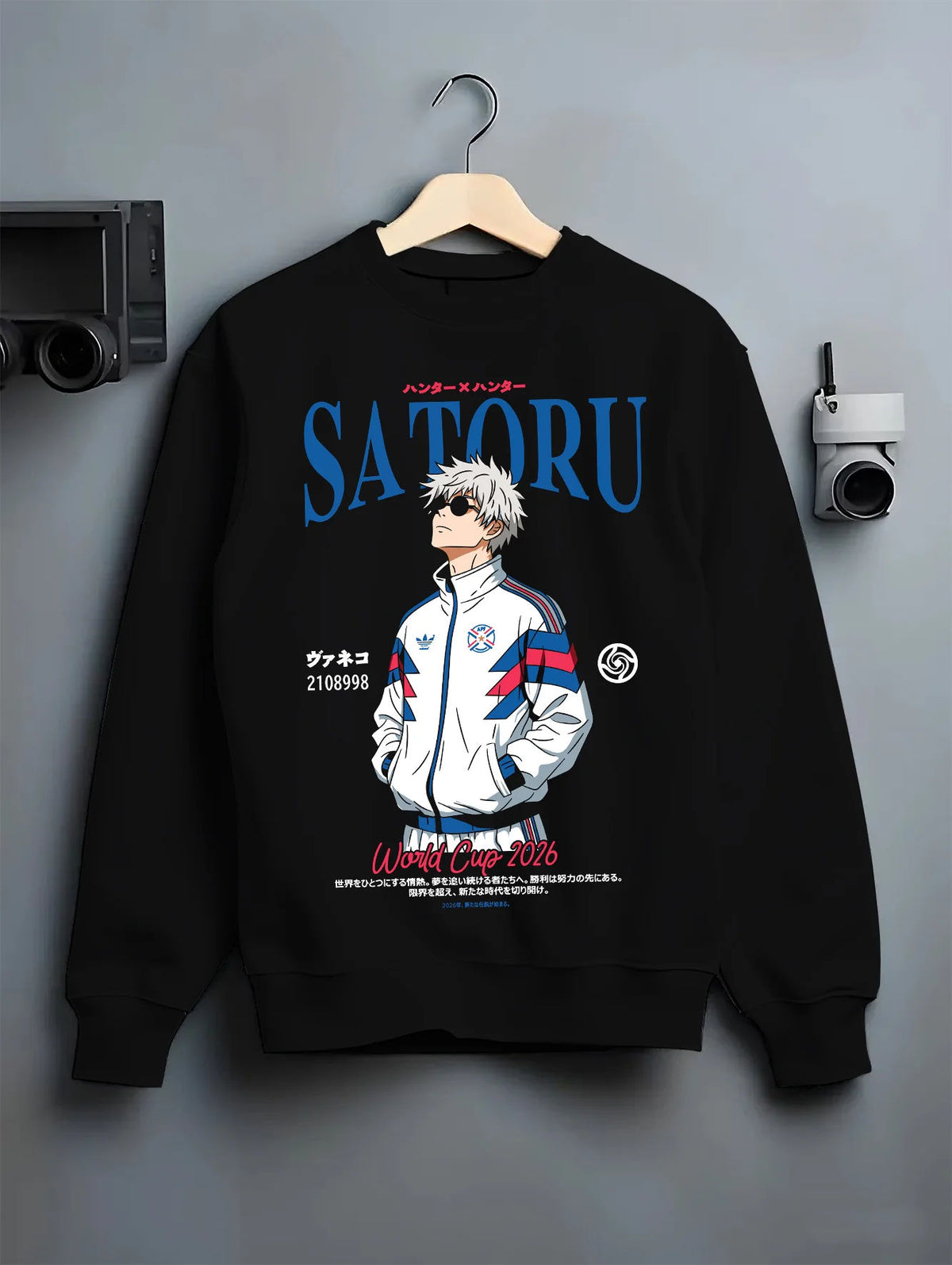Black crewneck sweatshirt on hanger showing Satoru Gojo from Jujutsu Kaisen: white football track jacket